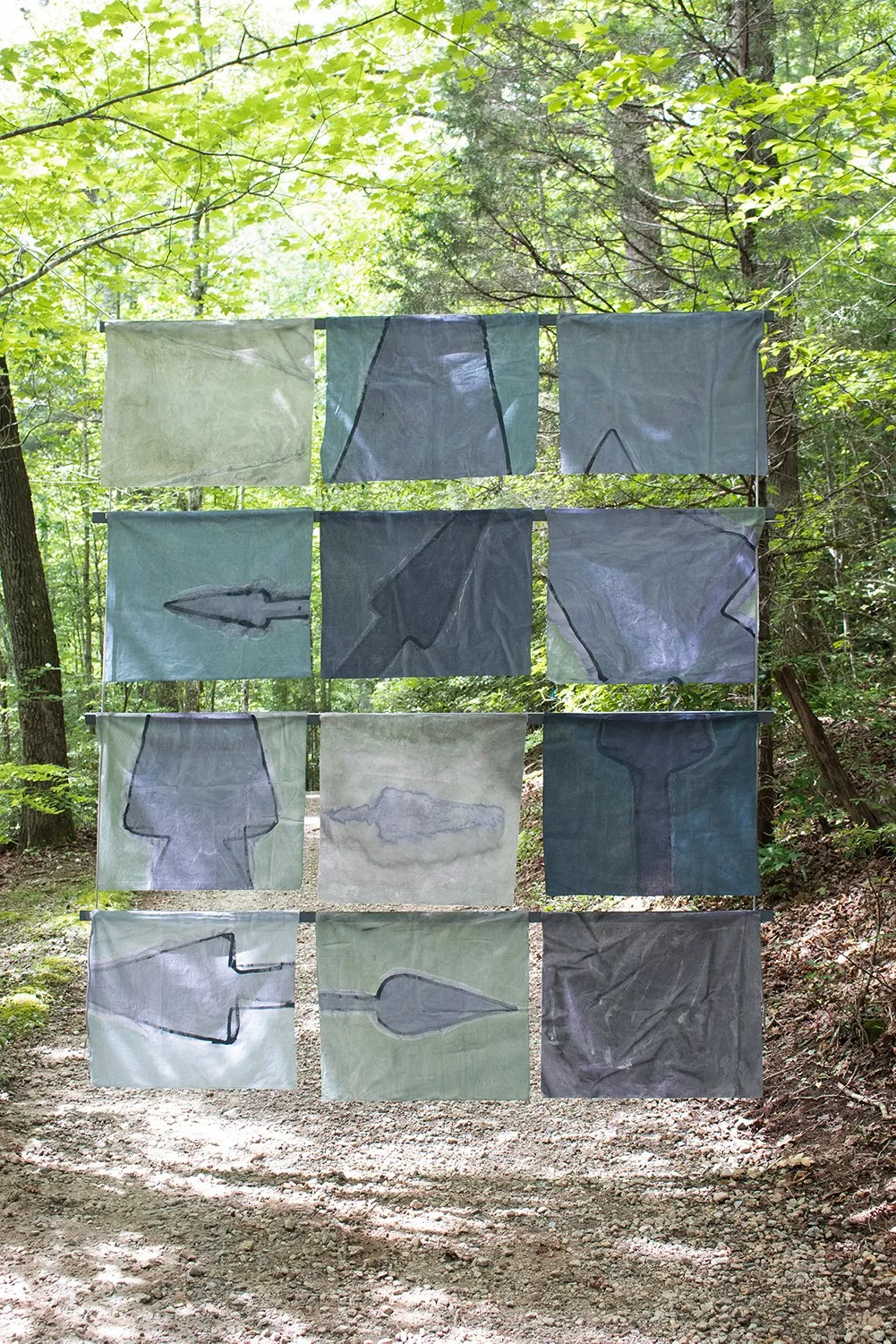 Song of Amergin (Floating, outdoors), Am bri i fodb fras feochtu/I am the head of the spear in battle, Acrylic, dye, muslin, rope, wood, cinder blocks, 120” X 96," Installation at the Hambidge Center for the Arts, Rabun Gap, GA, 2019, installation vi
