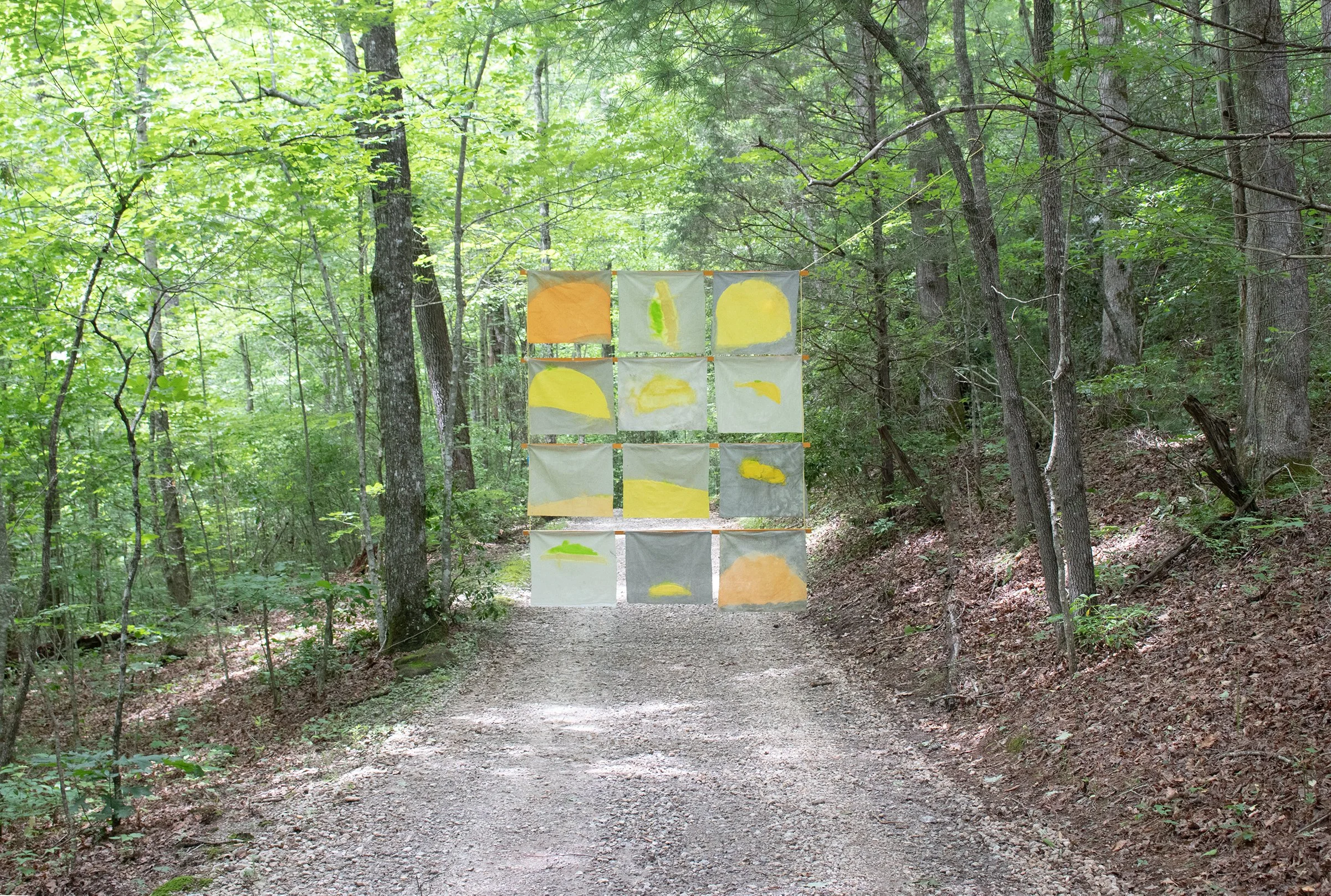 Song of Amergin (Floating, outdoors),  Am séig i n-aill/I am the tear of the sun, Acrylic, dye, muslin, rope, wood, cinder blocks, 120” X 96," Installation at the Hambidge Center for the Arts, Rabun Gap, GA, 2019