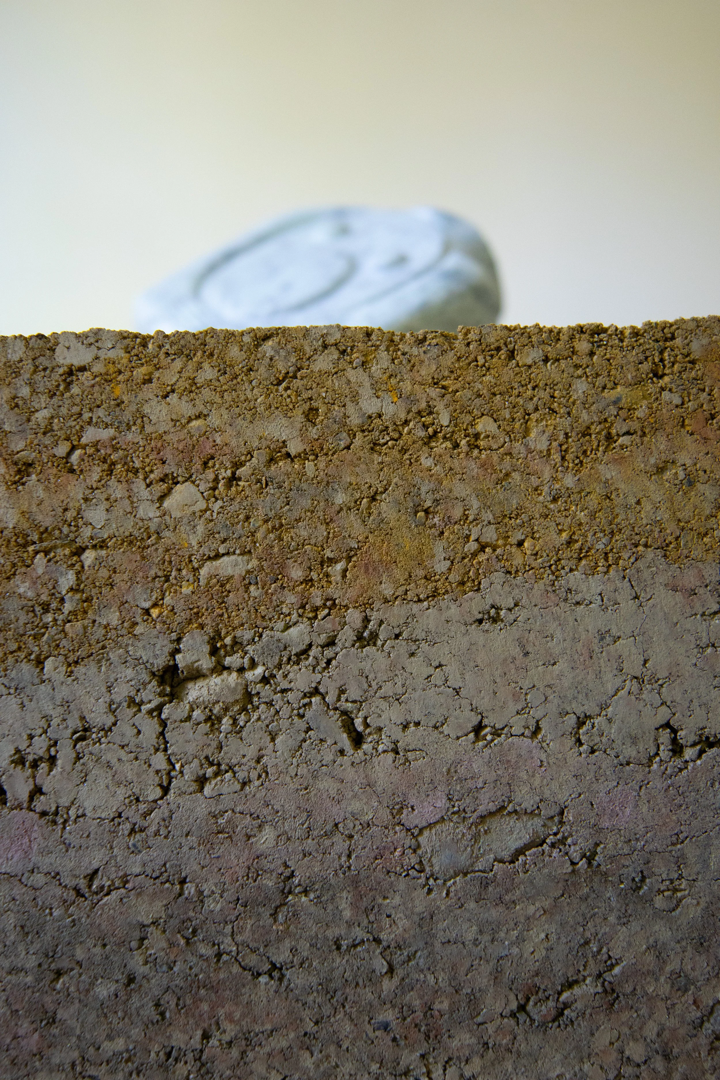 Vessel (The book is a reflection that never arrives… there is no touching), 2025, soapstone, earth, pine pedestal, 34” X 11.5” X 11” (detail iii)

Photo by Arseny Pekurovsky