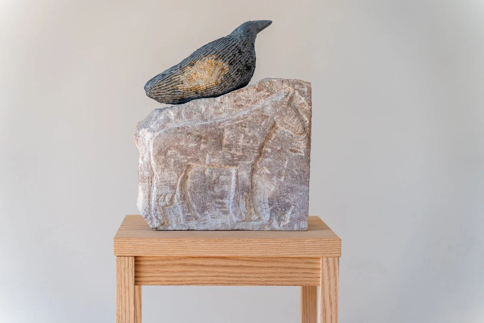 The Horse Was Stuck Inside The Lake, And The Crow Rested On The Surface Of The Lake, And We Called The Men To Extract The Horse From The Lake, And The Crow Was Beautiful And Still, And We Called The Men Again (Horse, Crow), 2024, Soapstone, alabaster