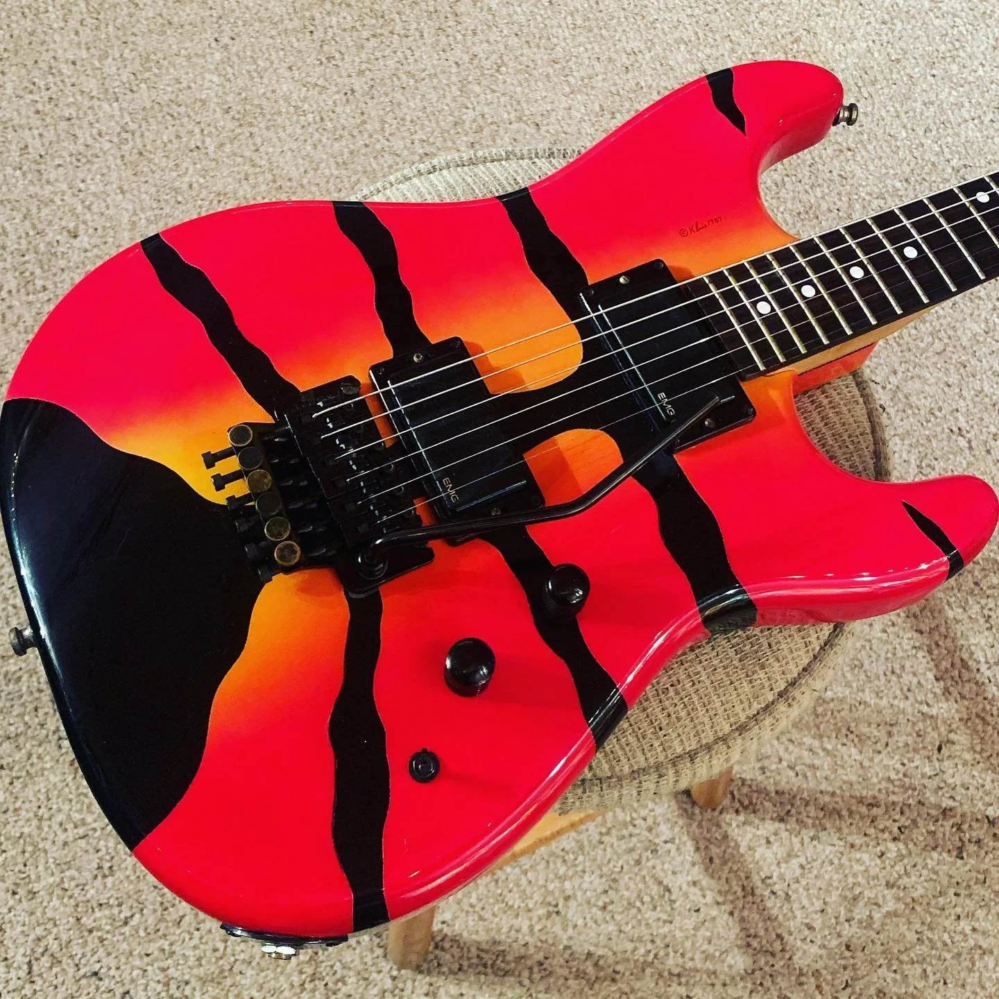 Electric guitar with a red, orange, and black design resembling tiger stripes, Kramer Guitar, Airbrushed Guitar. Dennis Kline, Kline, airbrushed 80s, 1980s, George, Lynch,