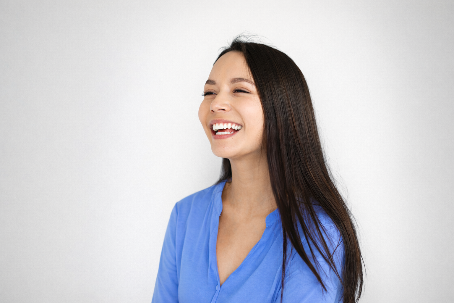 Woman smiling in blue sweater