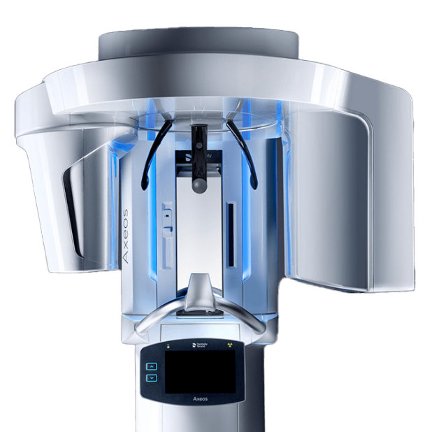 Medical imaging machine, likely a CT scanner, with a large circular opening, digital control panel, and blue lighting illumination.