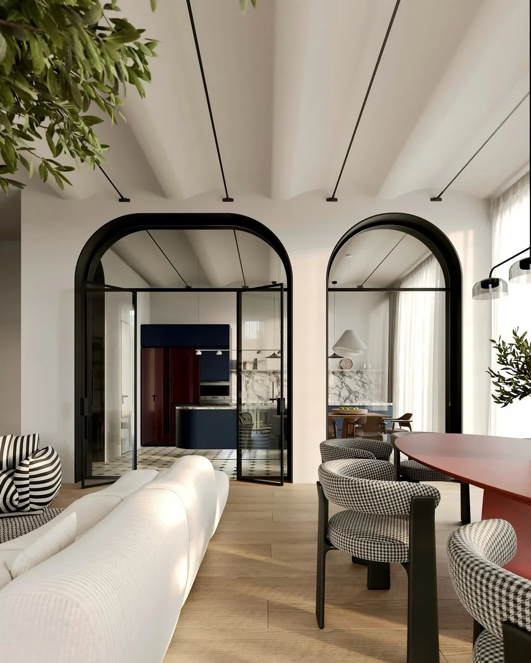 Salon moderne avec arches noirs, canapé blanc, table ronde avec chaises à motif pied noir, cuisine en arrière-plan avec mur en marbre et planche de bois, grande fenêtre avec rideaux transparents, plantes vertes