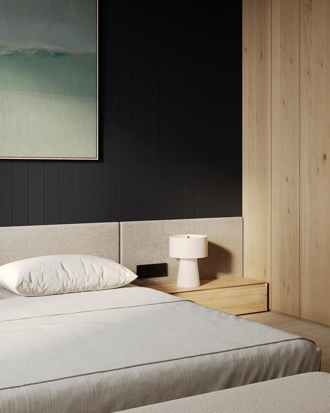 Chambre moderne avec lit en lit, table de nuit en bois, lampe blanche, et œuvres d'art abstraites sur le mur.