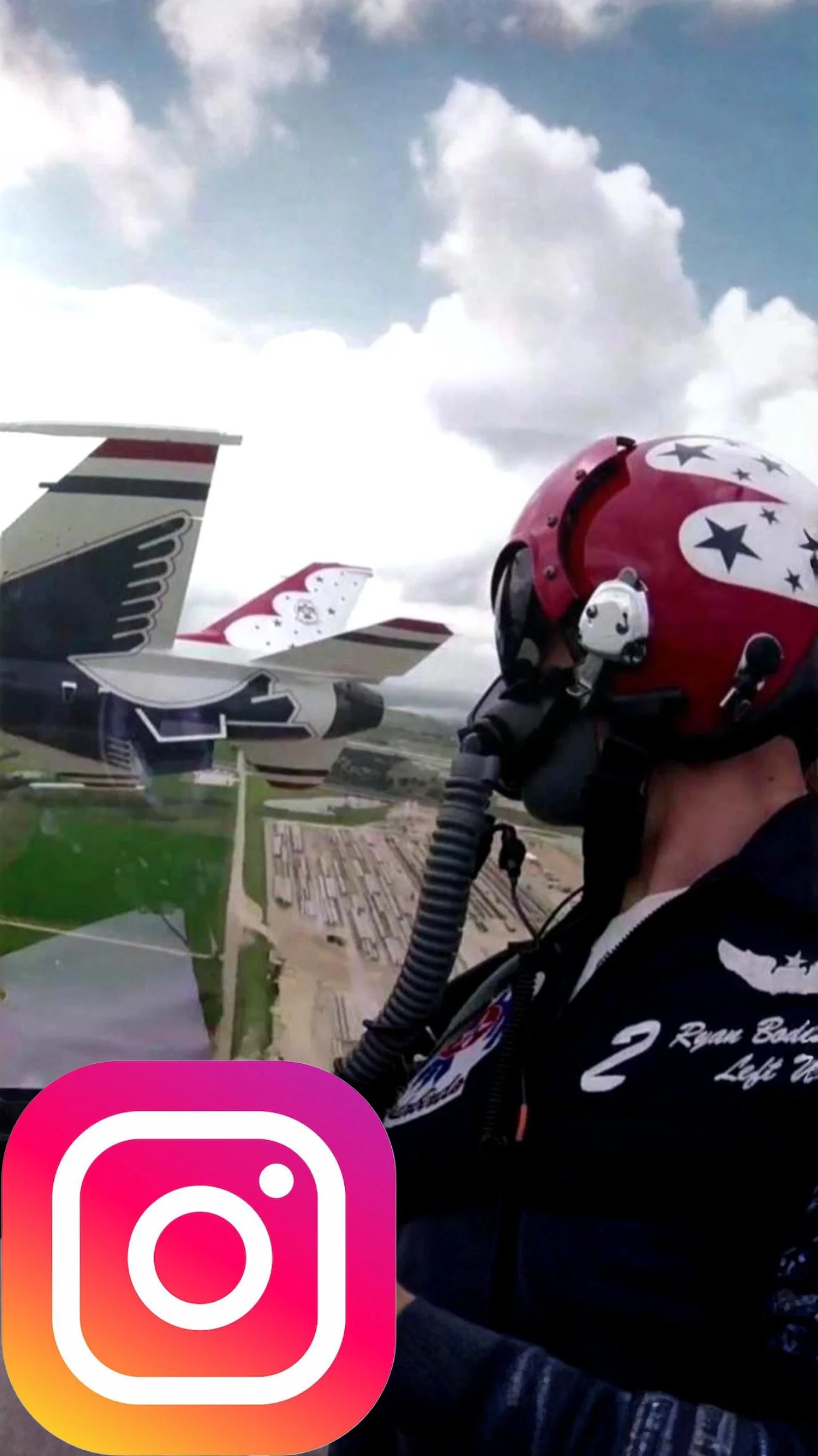 A fighter pilot wearing a red helmet with star and circle designs, flying an aircraft. The aircraft is decorated with star motifs and has a tail fin featuring a wing design. The pilot is wearing a black flight suit with insignia.