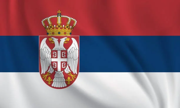 Flag of Serbia with red, blue, and white horizontal stripes and coat of arms in the center featuring a double-headed eagle and a crown.