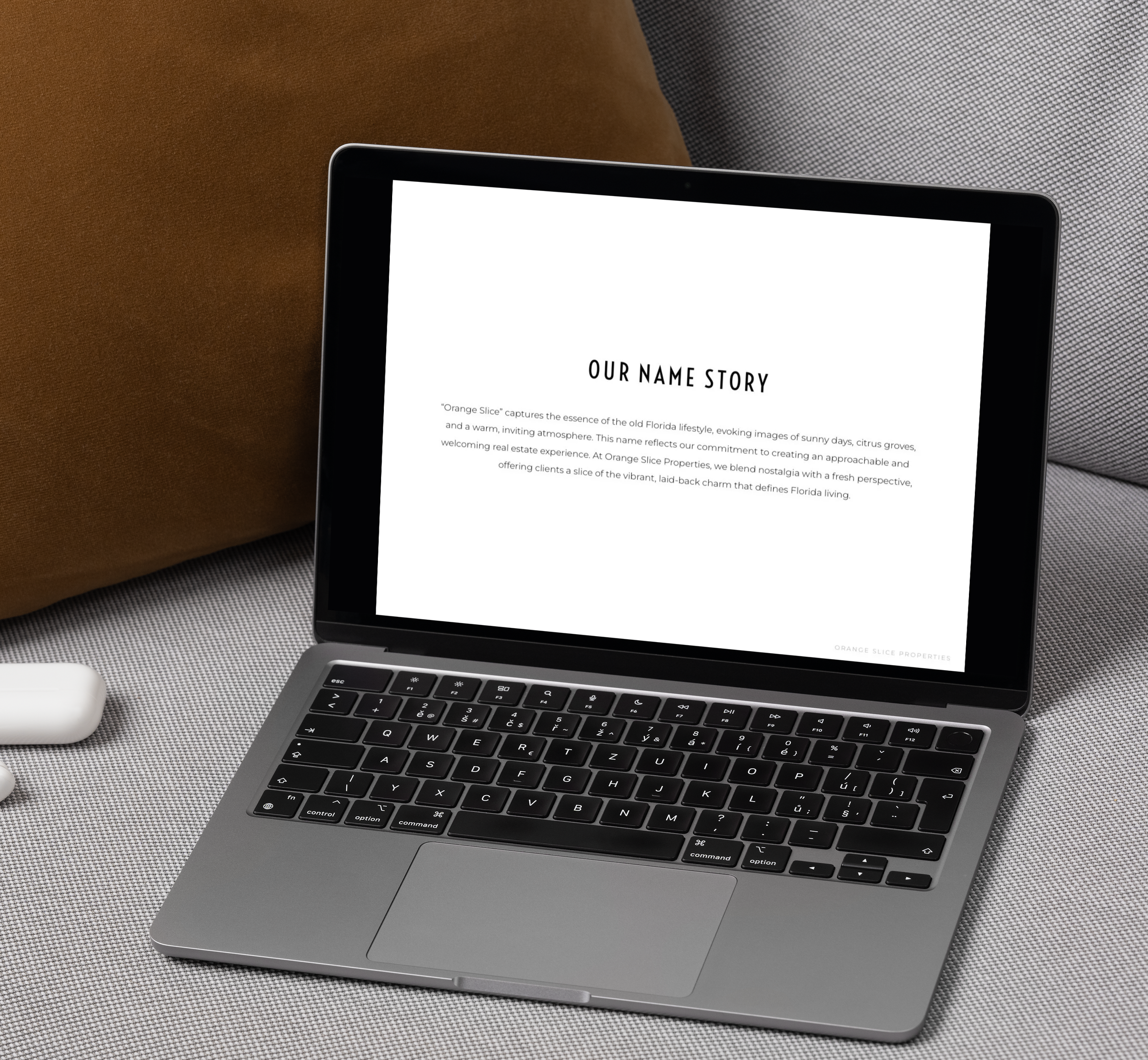 Open laptop on a desk displaying a webpage titled 'Our Name Story', with a white background and black text.