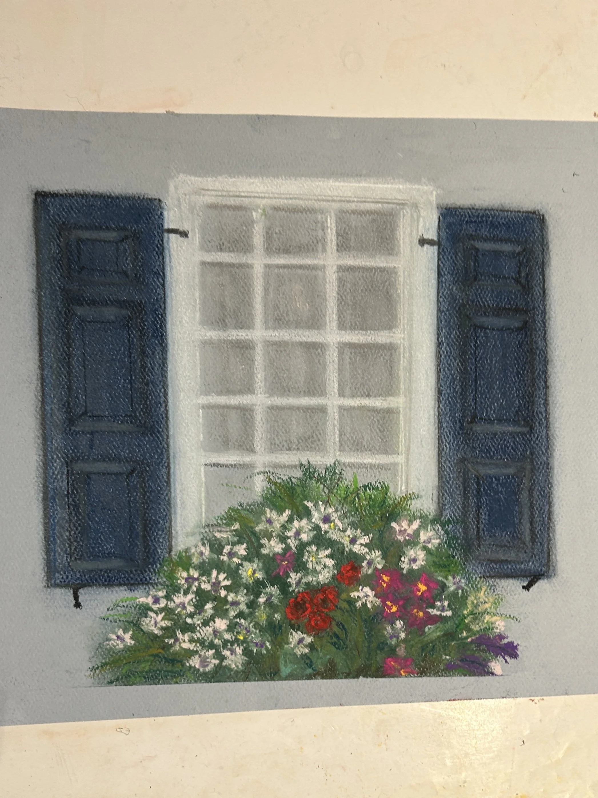 Painting of a window with blue shutters and a flower box filled with colorful flowers on a white wall.