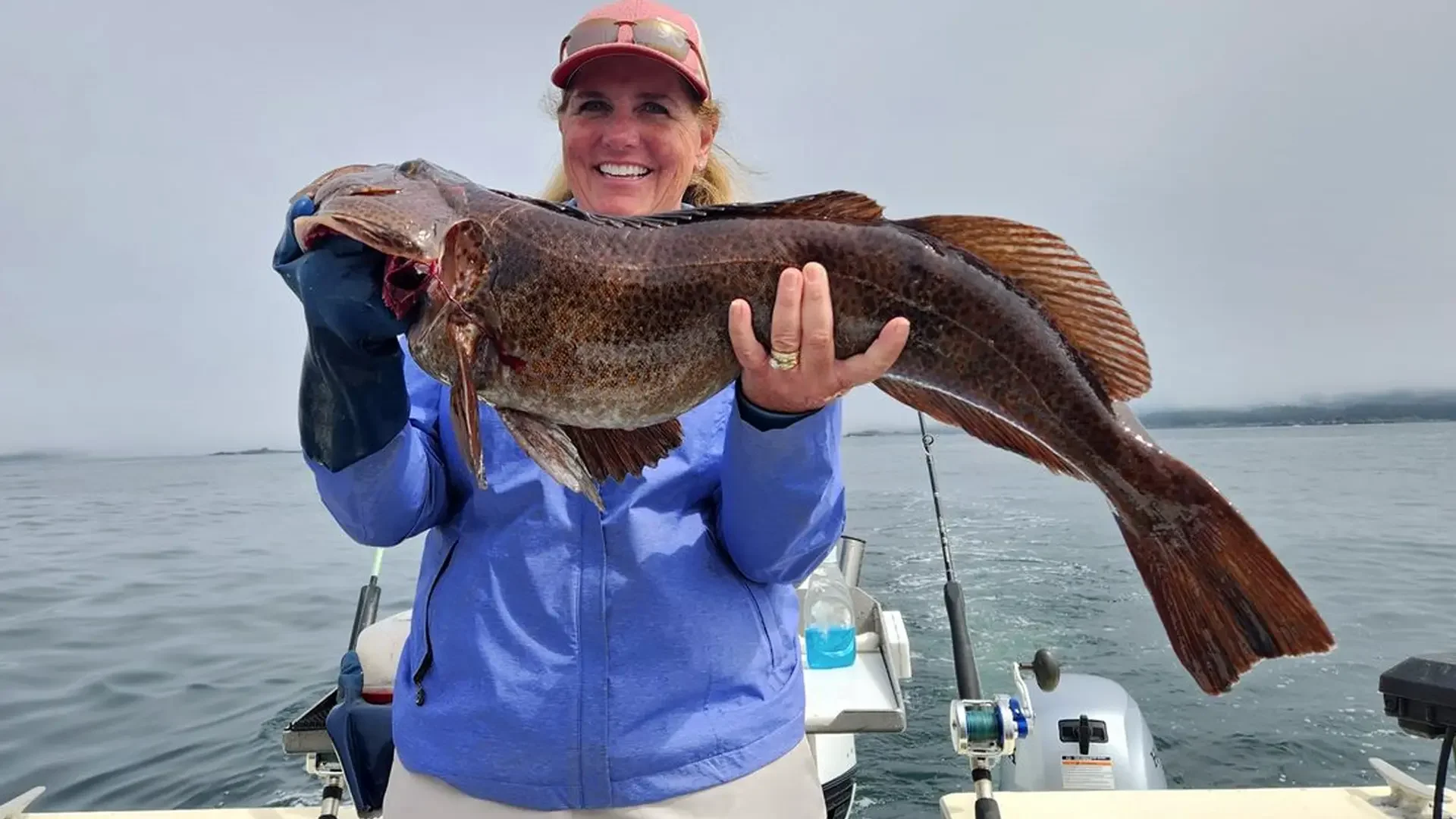 alaska-fishing-cruise.html-gal-with-large-ling-cod-in-the-boat-017.webp