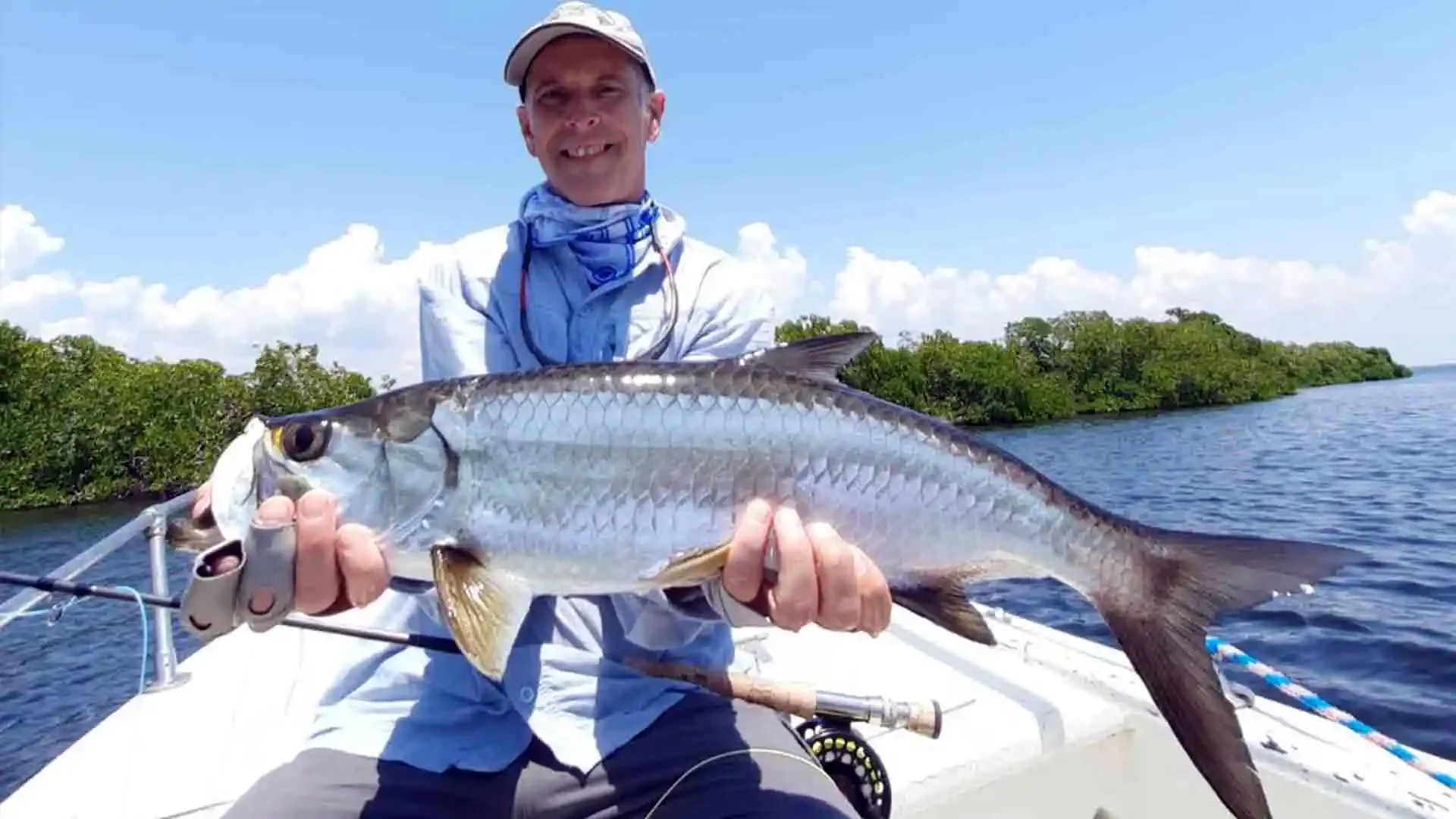 angler-holding-tarpon-fly-rod-campeche-mexico-mangroves.webp.webp