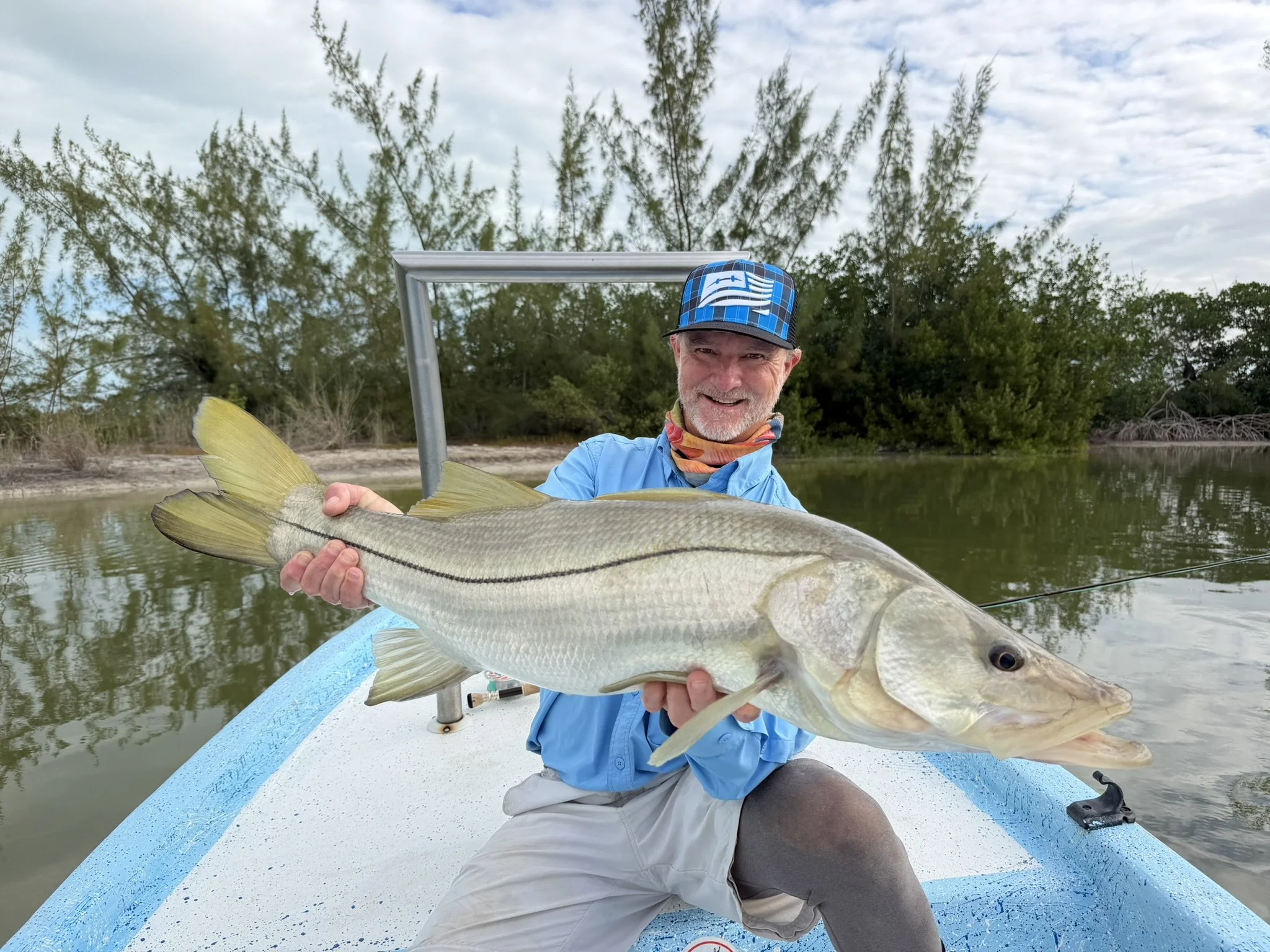 angler-holding-snook-ascension-bay-kay-fly-lodge.jpg