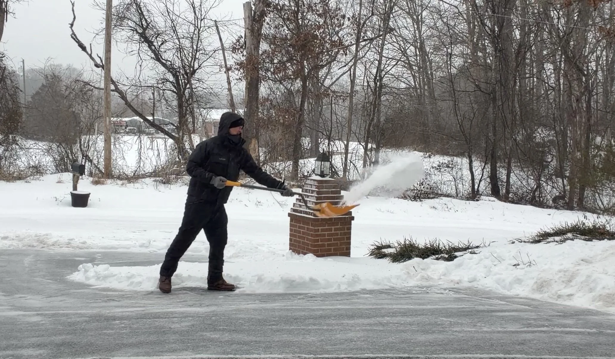 man-shoveling-snow-winter-storm-central-virginia.jpg