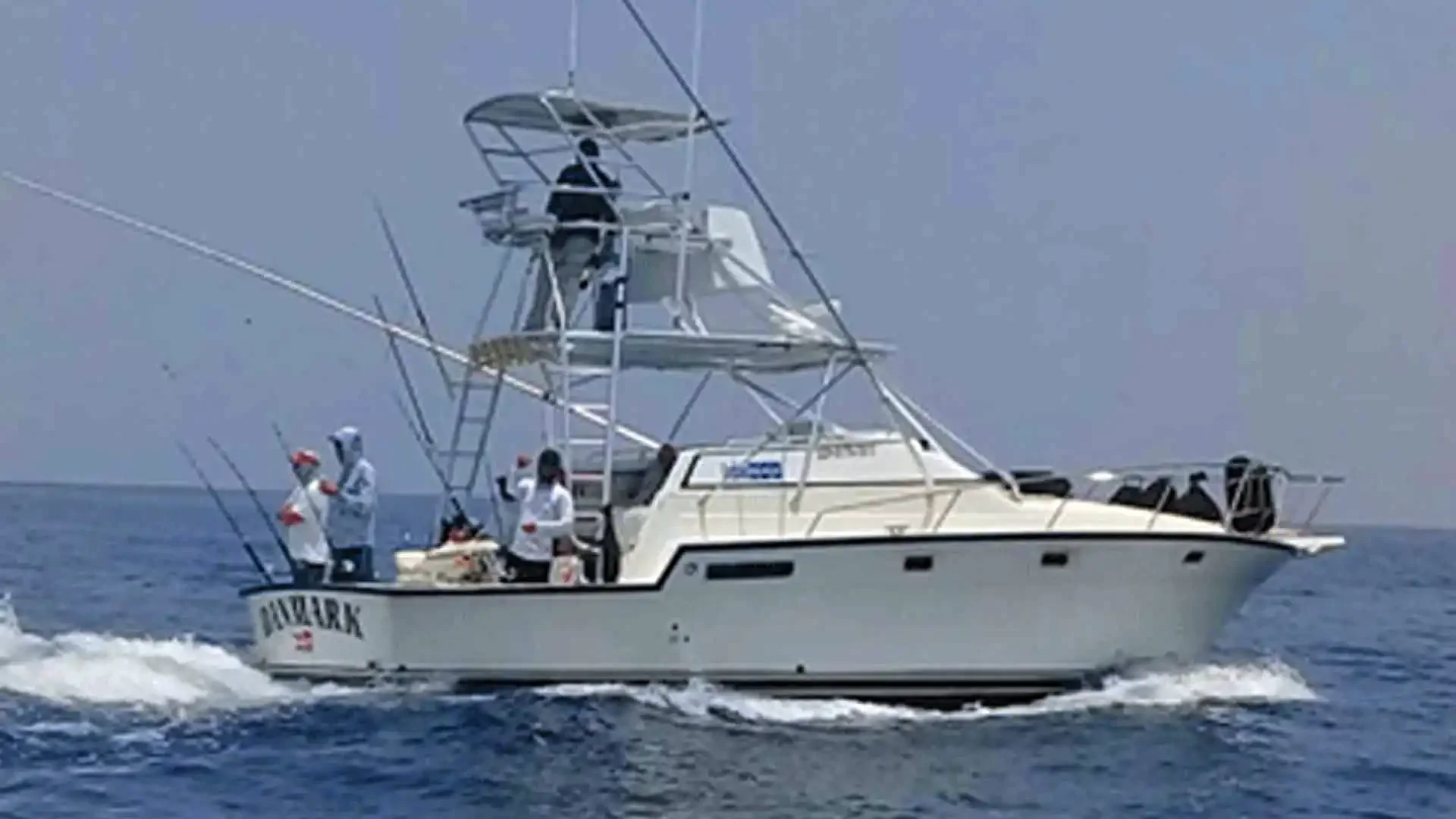 Danmark, a 34-foot Luhrs express sportfishing boat powered by twin 380 HP Yanmar engines for offshore fishing.