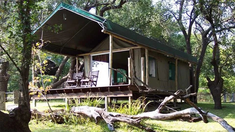 Elevated safari tented camp in Tanzania, offering comfortable accommodation for tigerfish anglers in Africa.