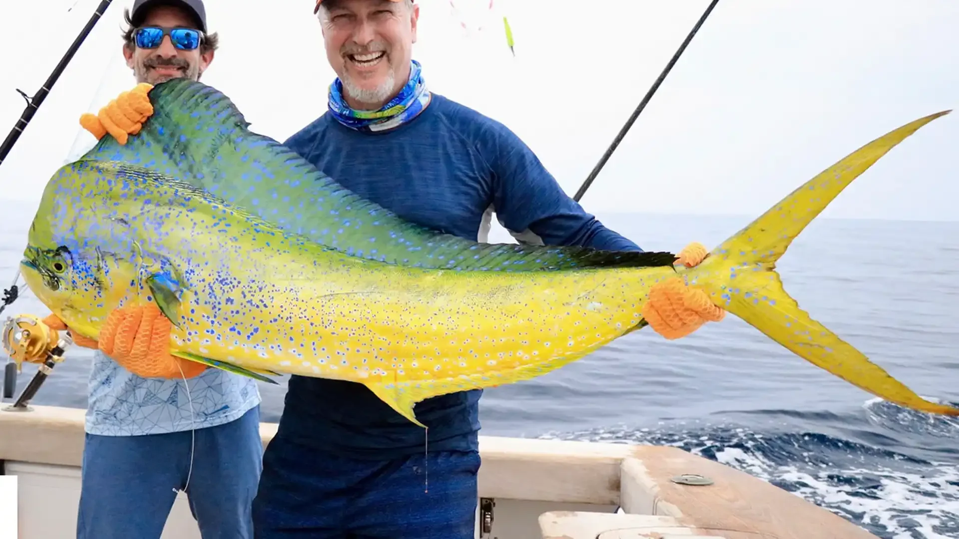 Happy angler and guide in Guatemala displaying a large Bull Mahi Mahi (Dorado) caught during a sportfishing trip at Sailfish Oasis Lodge.