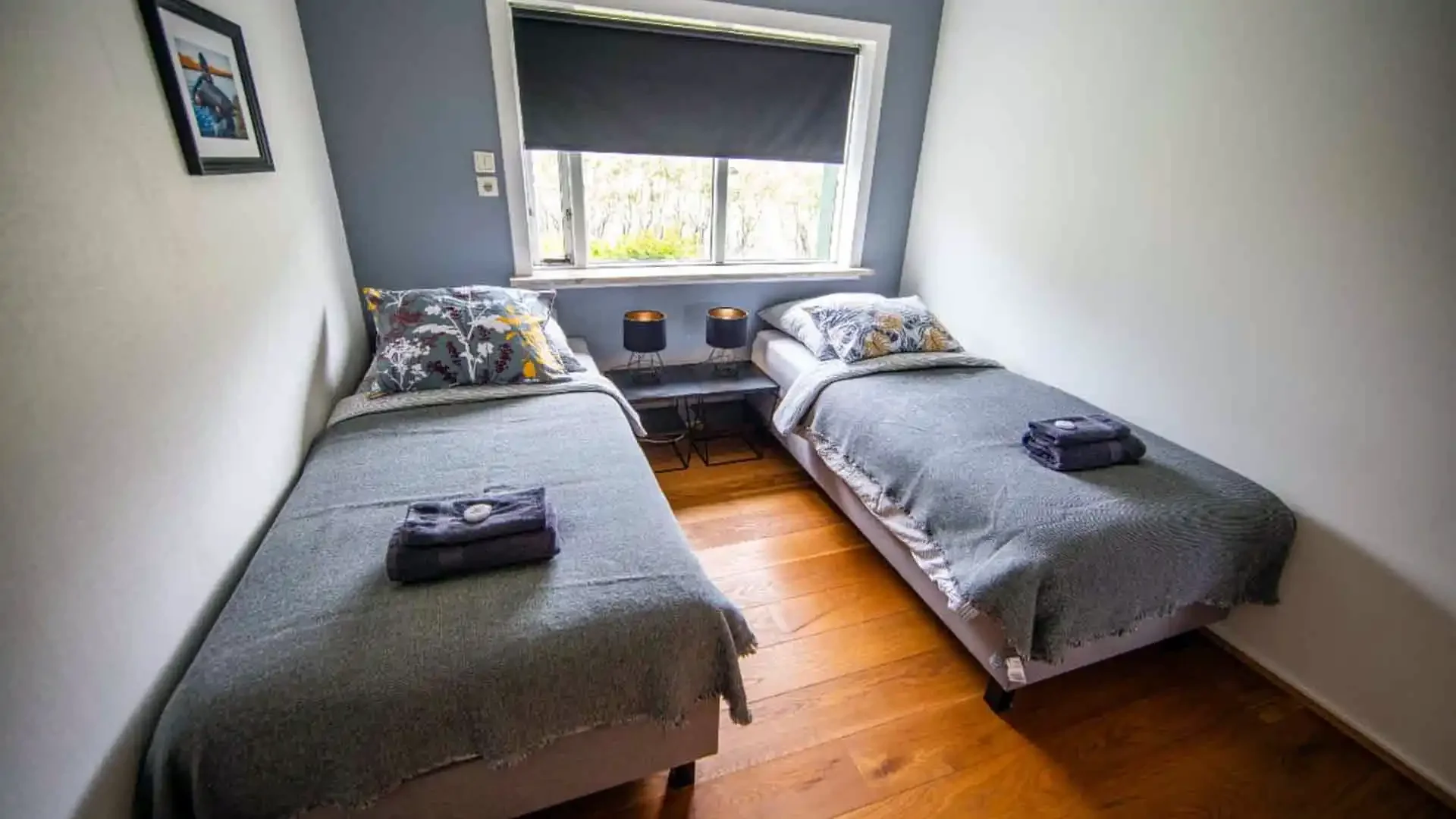 Comfortable twin bedroom at Battle Hill Lodge in Iceland, perfect for anglers after a day of fly fishing.