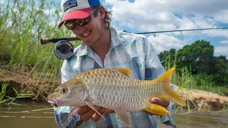 fly-fishing-angler-african-yellowfish-tanzania-river.jpeg
