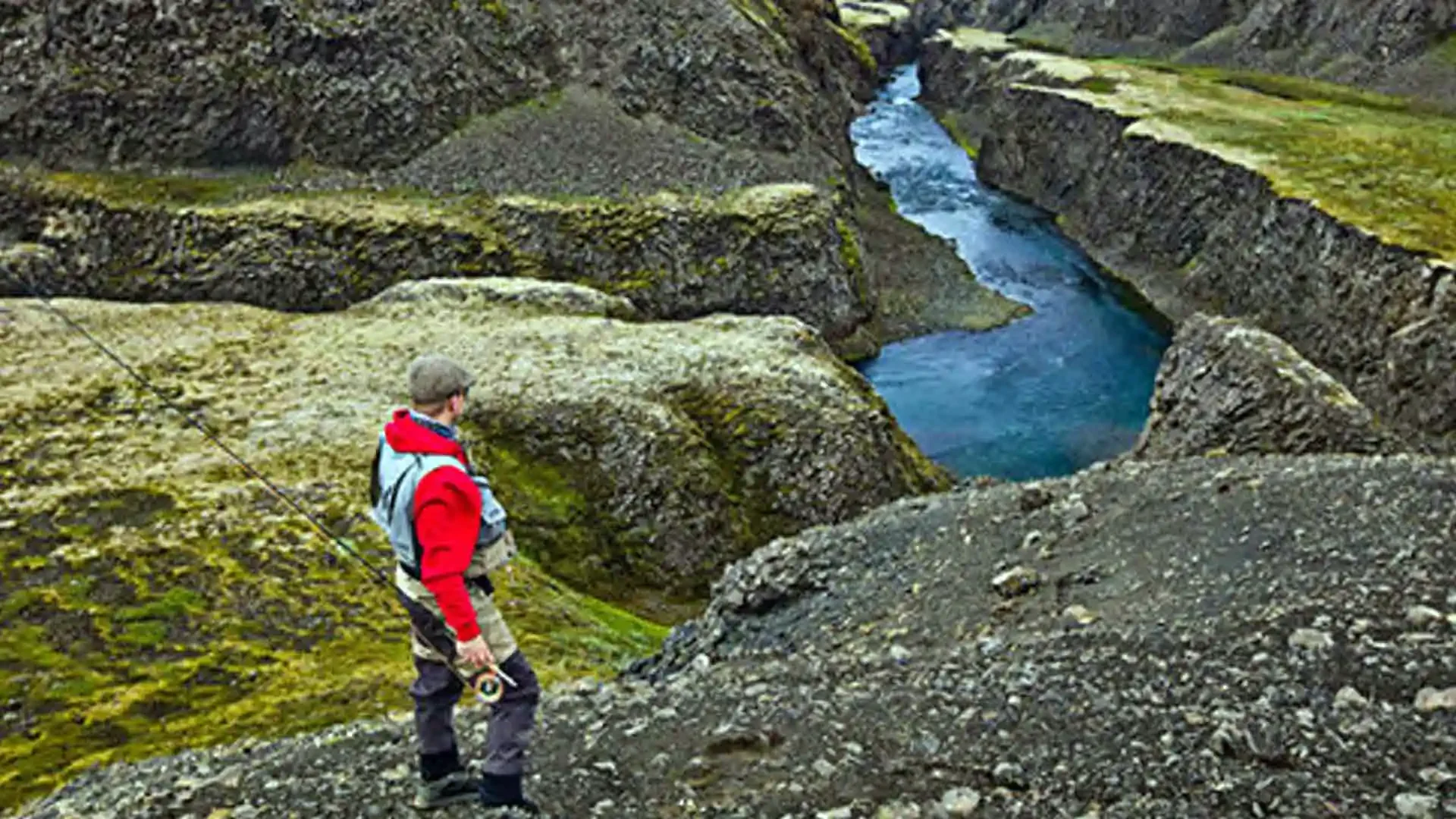 iceland-trout-fishing-canyon-river-fly-fisherman.webp