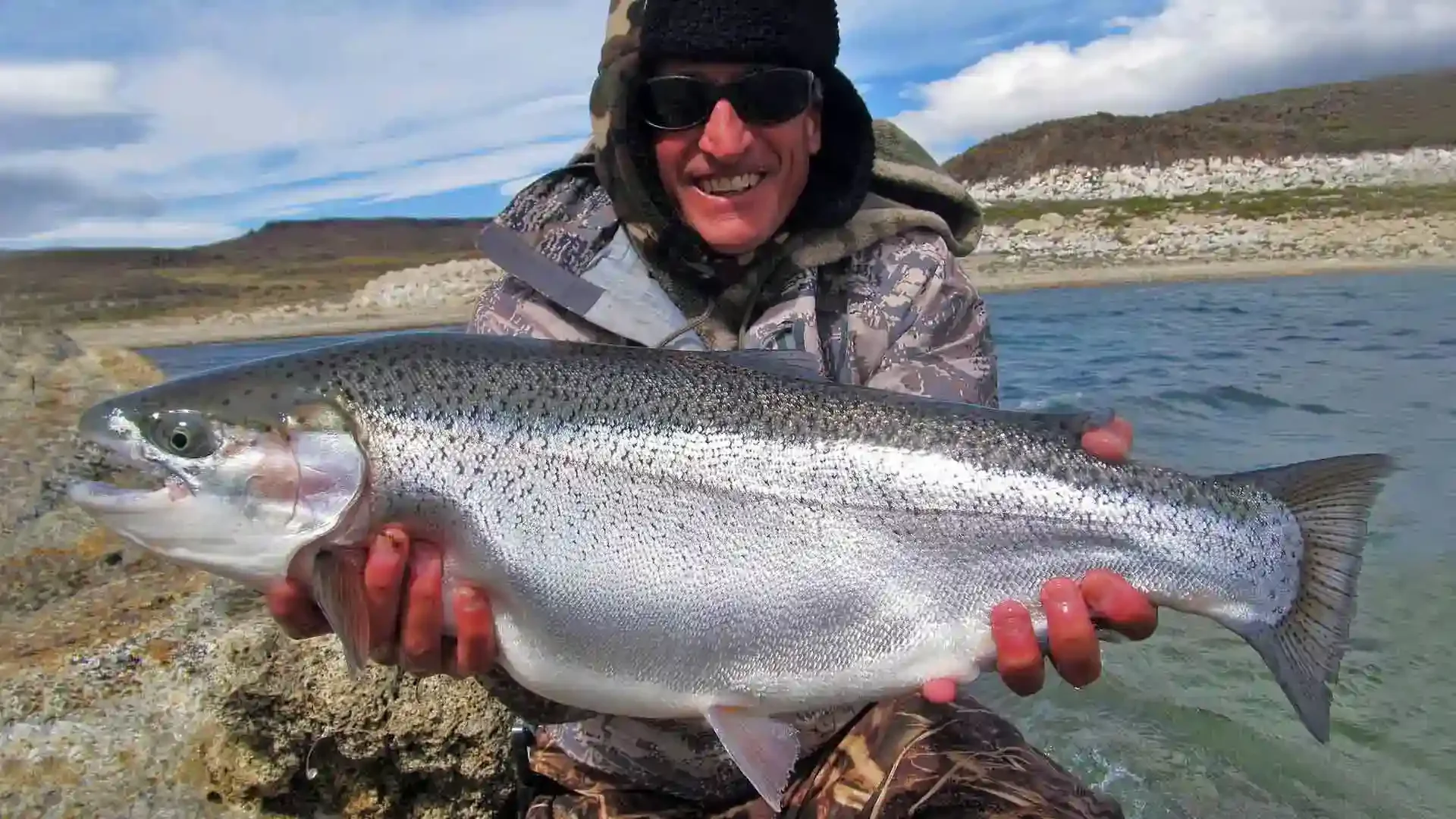 jurassic-lake-lodge-argentina-giant-rainbow-trout-angler.webp