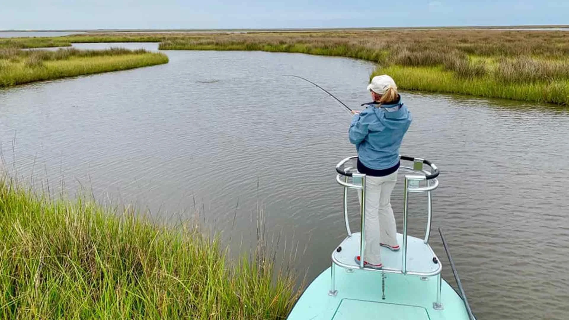 dogwood-lodge-lower48-woman-fly-fishing-salt-flat-marsh.jpg