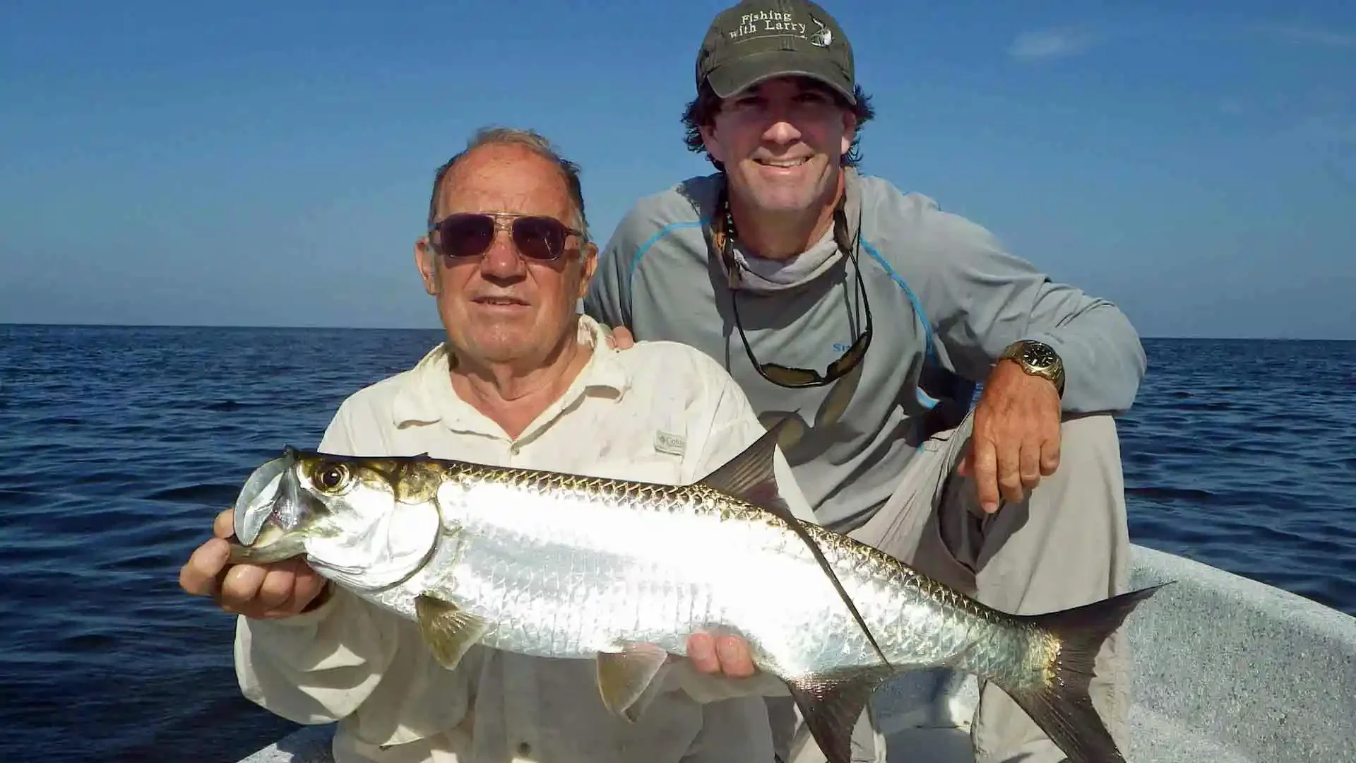 two-anglers-holding-small-tarpon-fishing-boat-campeche-mexico.webp.webp