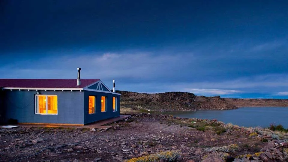 Estancia Laguna Verde Lodge on Jurassic Lake in Argentina, offering exclusive rainbow trout fishing access.