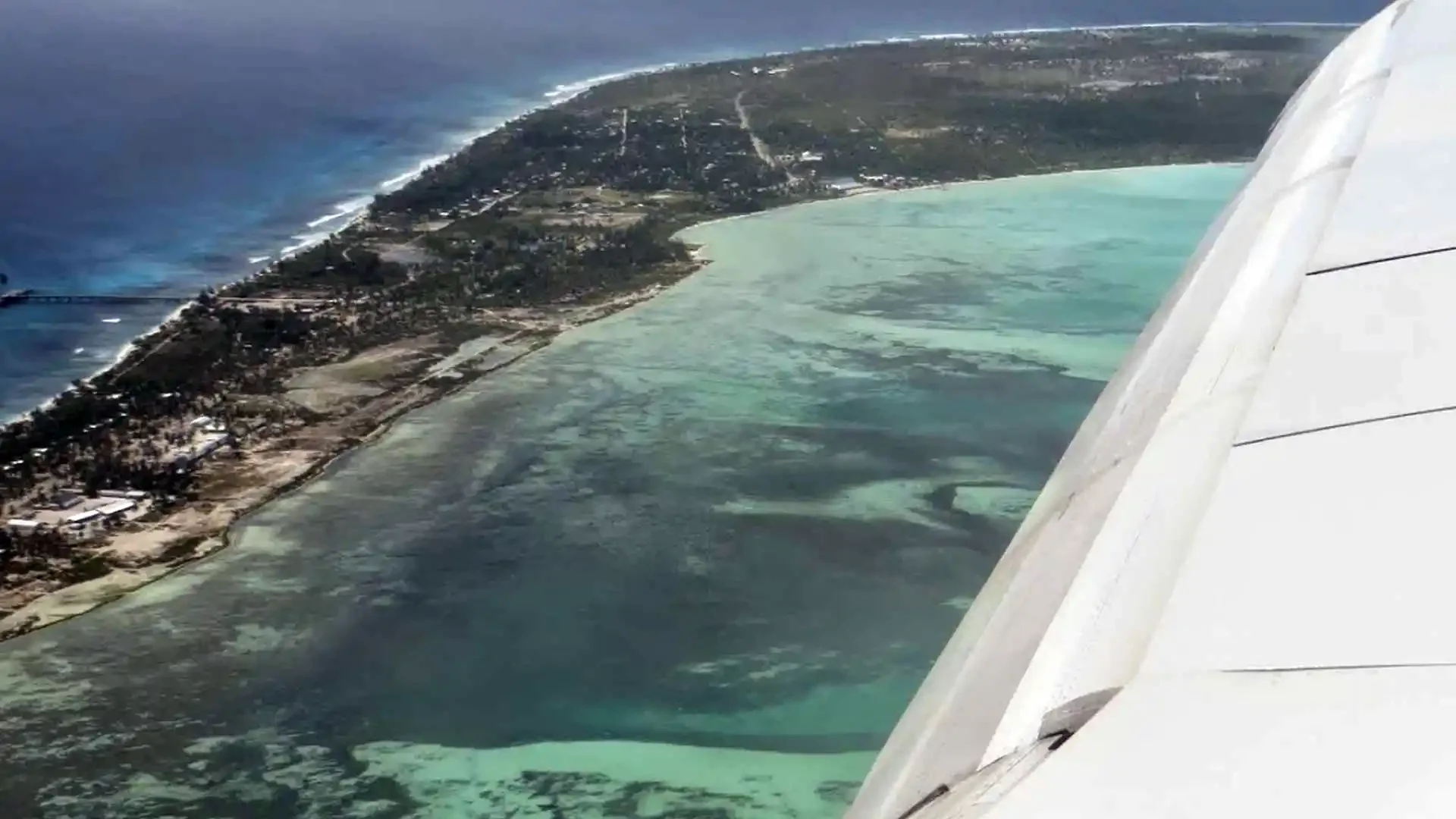 Aerial view of Christmas Island, Kiribati showing coral atoll, lagoons, and surrounding Pacific waters