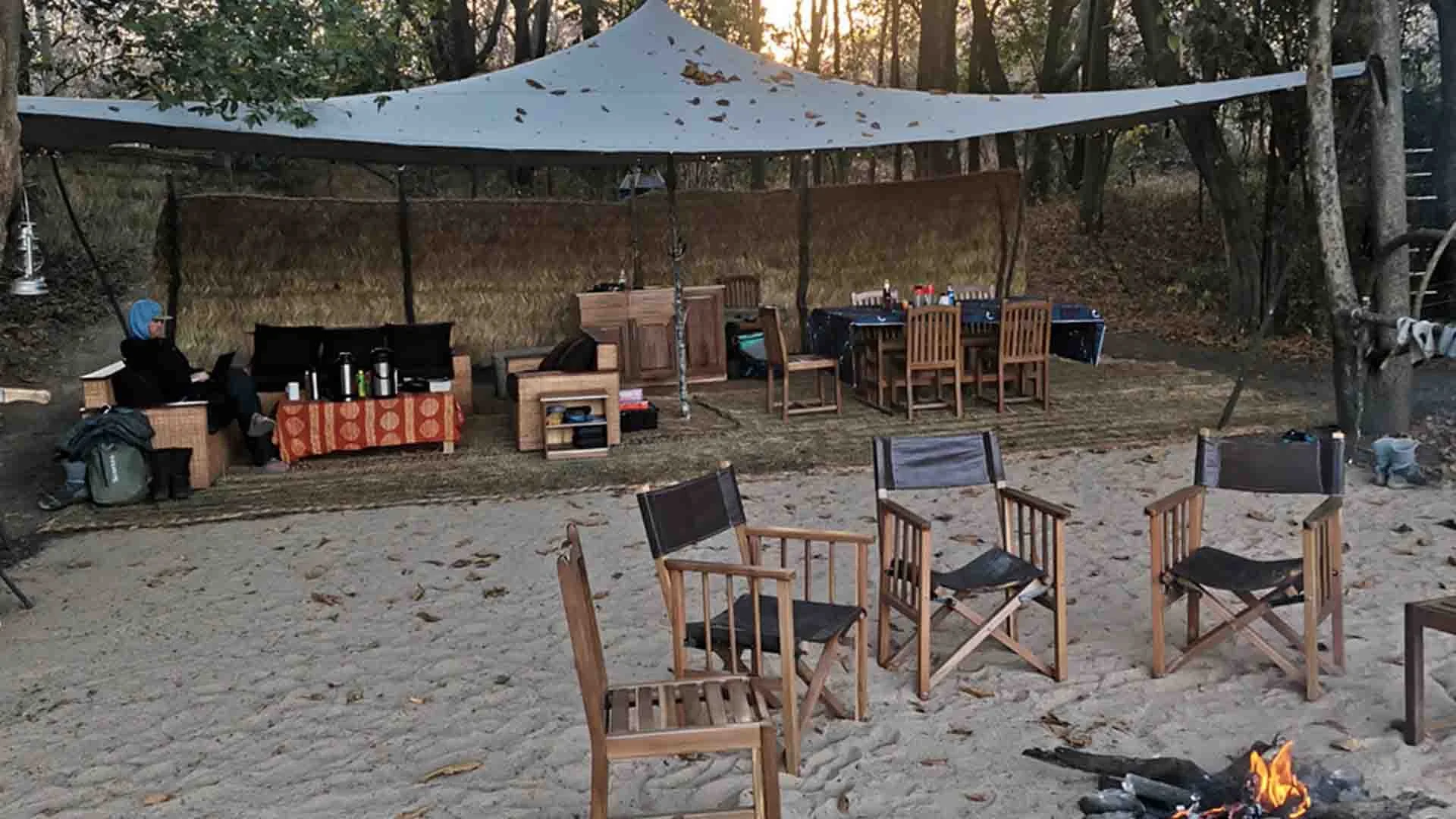 Dining and gathering area at Gassa Basecamp on Africa’s Faro River, perfect for anglers and wildlife enthusiasts.