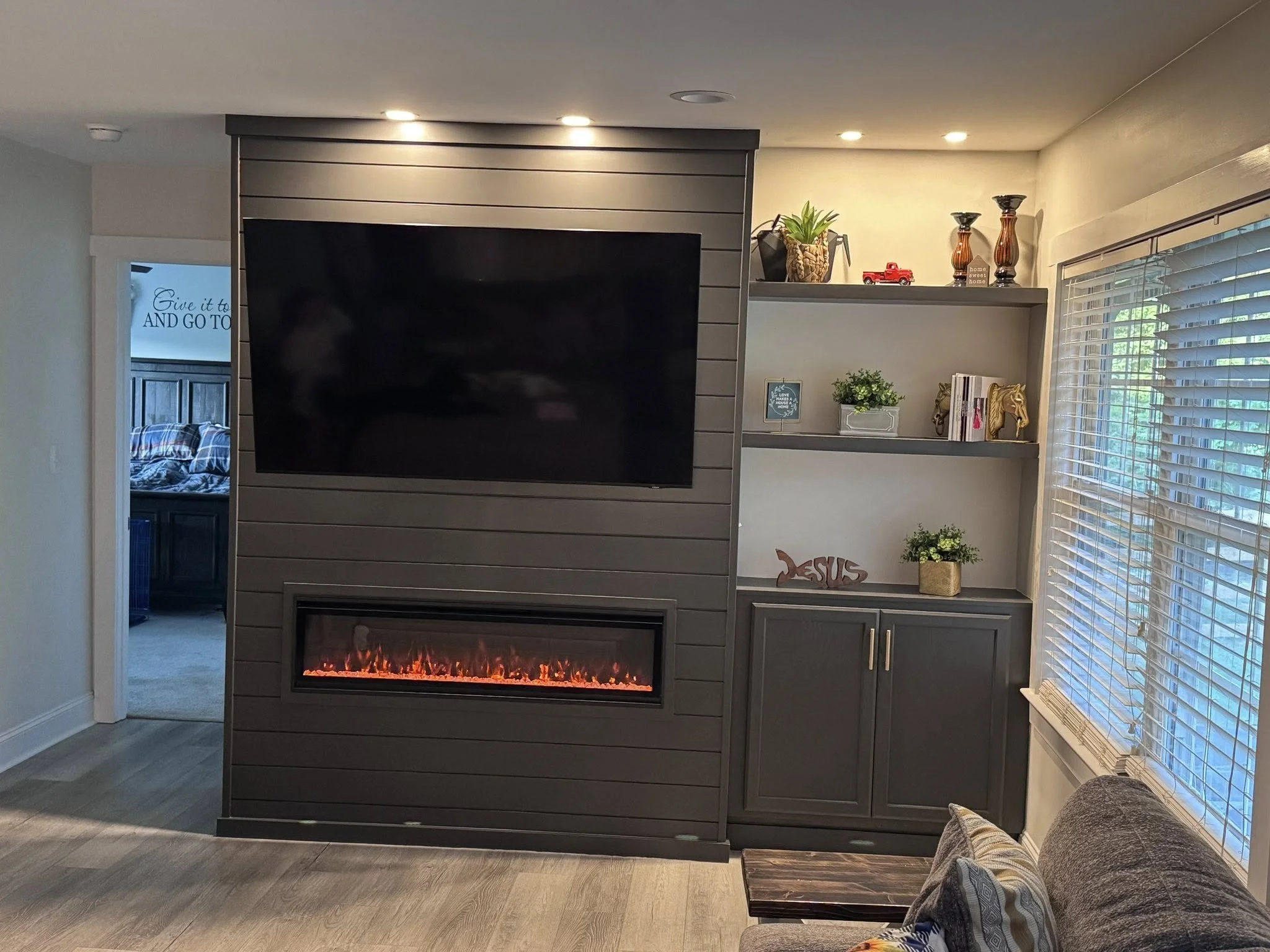 residential fireplace built. electric fireplace. built in fireplace, cabinets and shelves, living room