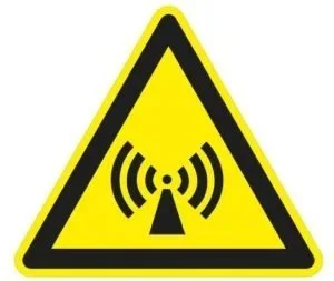Warning sign with a yellow triangle and black border, displaying a radio frequency symbol indicating electromagnetic or radio signal hazard.