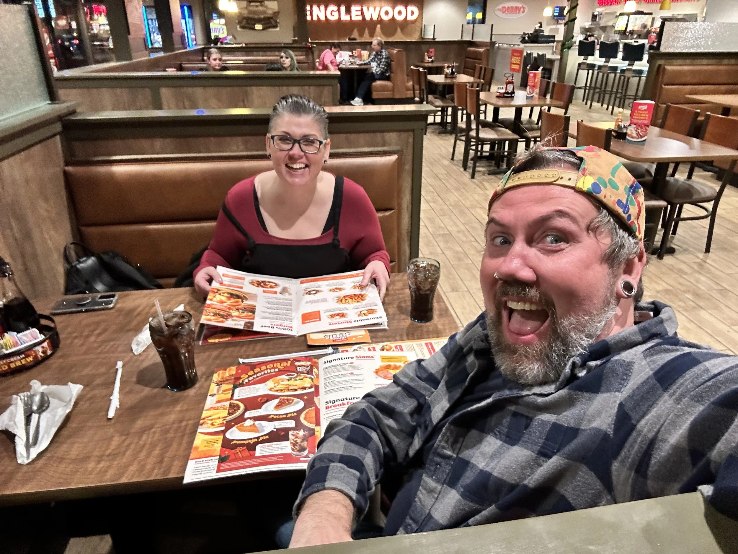 Picture of Rick Somerson making faces at the camera at the Denny's on Hampden with his friend Kim.