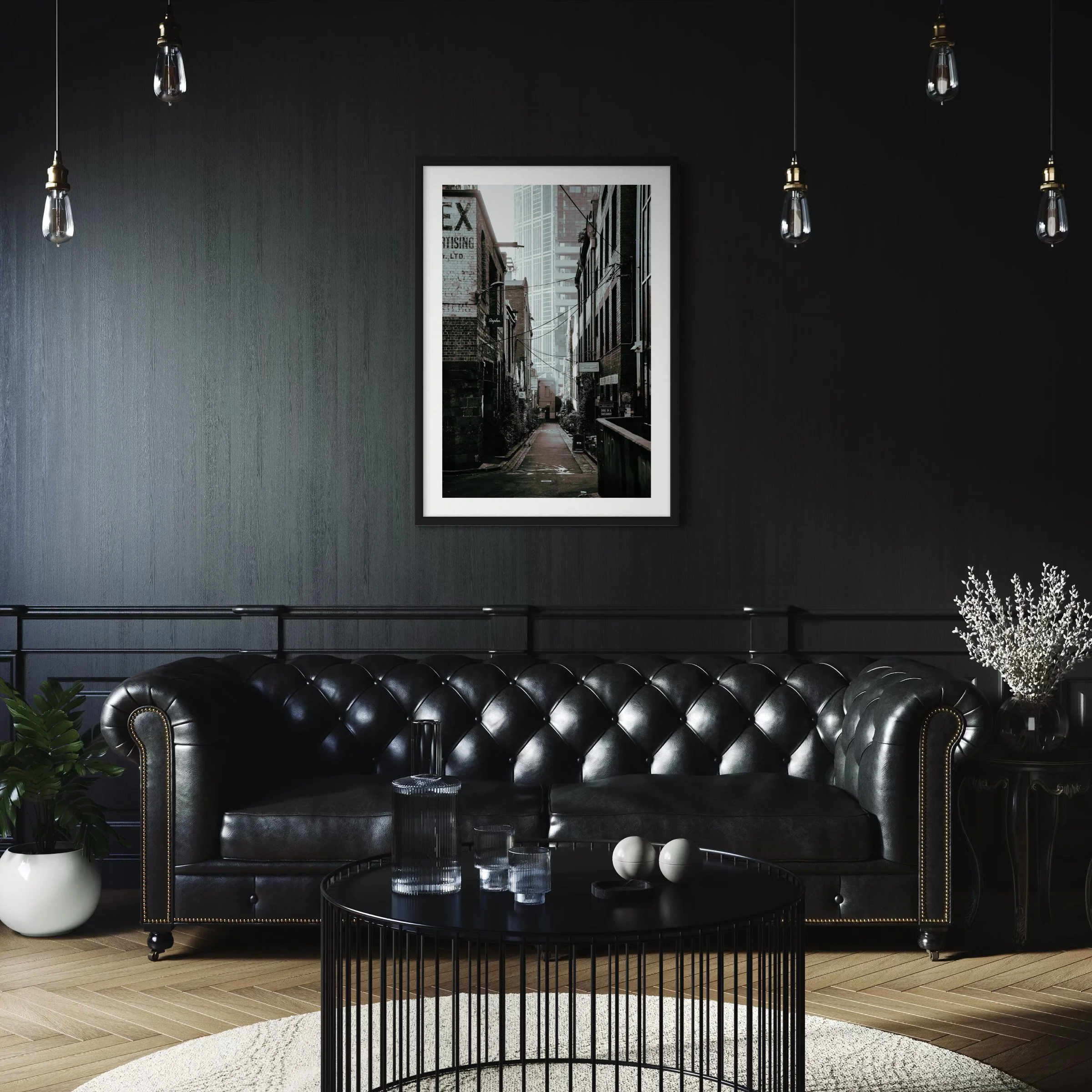 Moody monochrome Melbourne street photography print displayed above a black leather sofa in a dark contemporary interior.