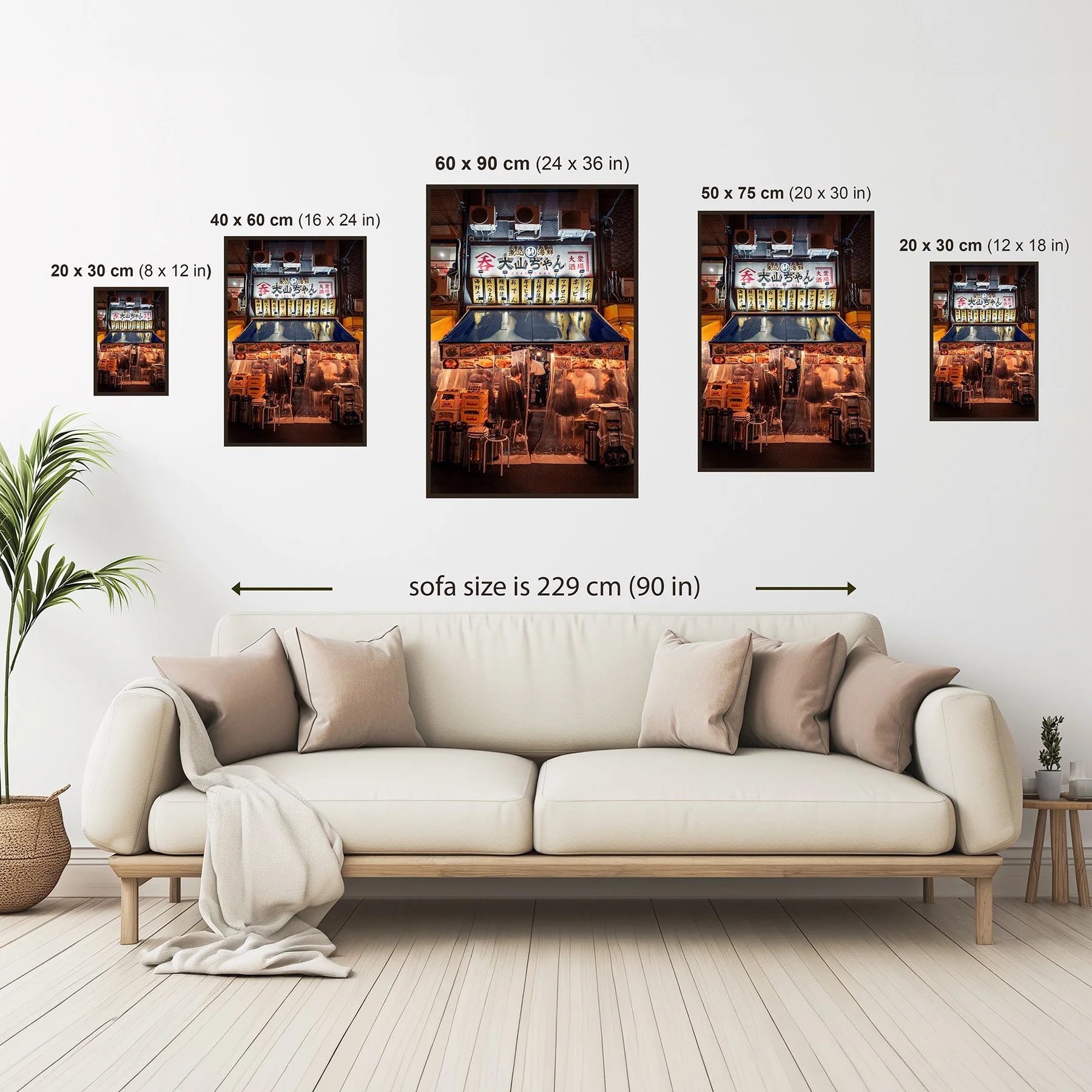 Photography print size guide showing available wall art sizes from 20 × 30 cm to 60 × 90 cm above a sofa for scale.