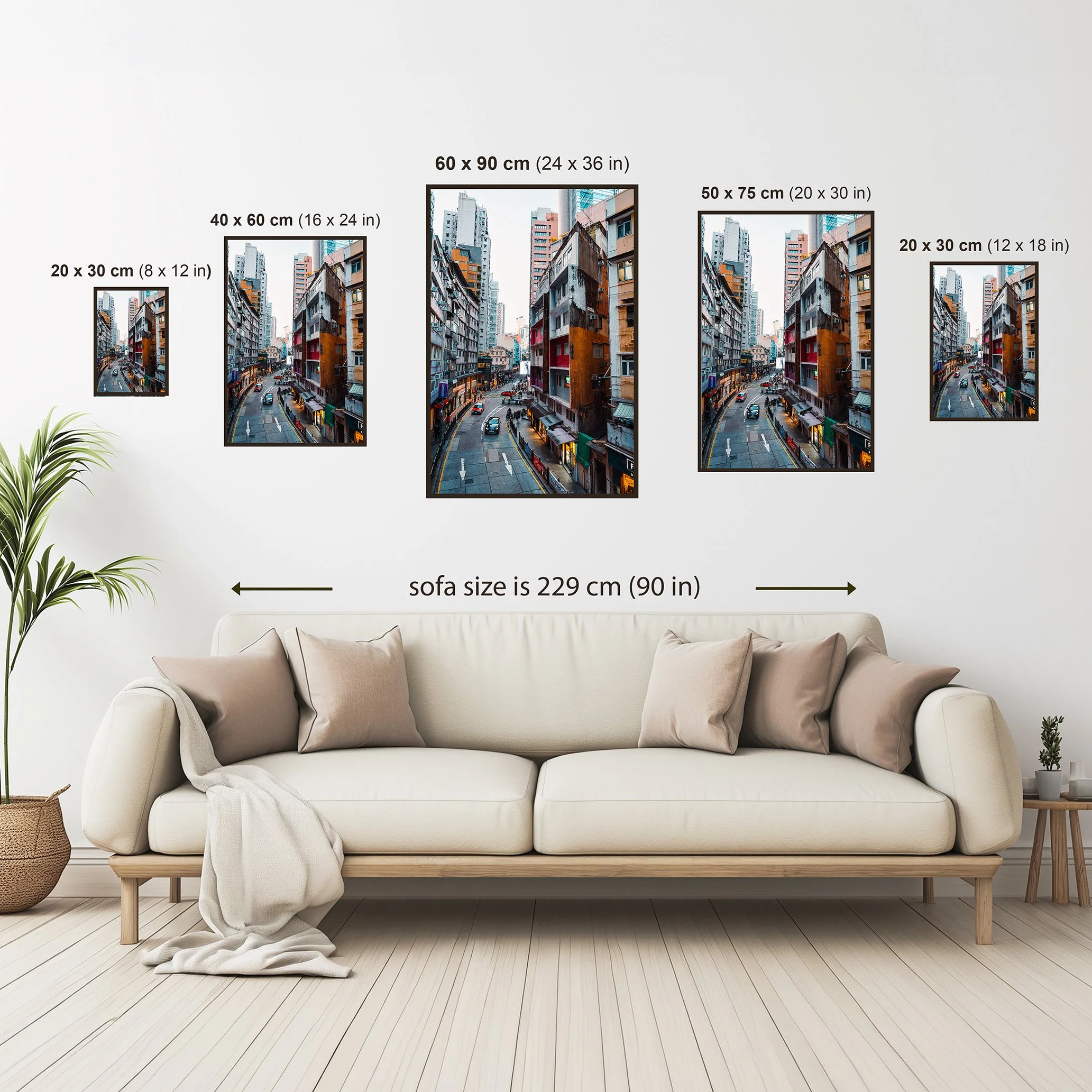 Size comparison guide for vertical Hong Kong photography wall art print showing available framed print dimensions above a neutral sofa.