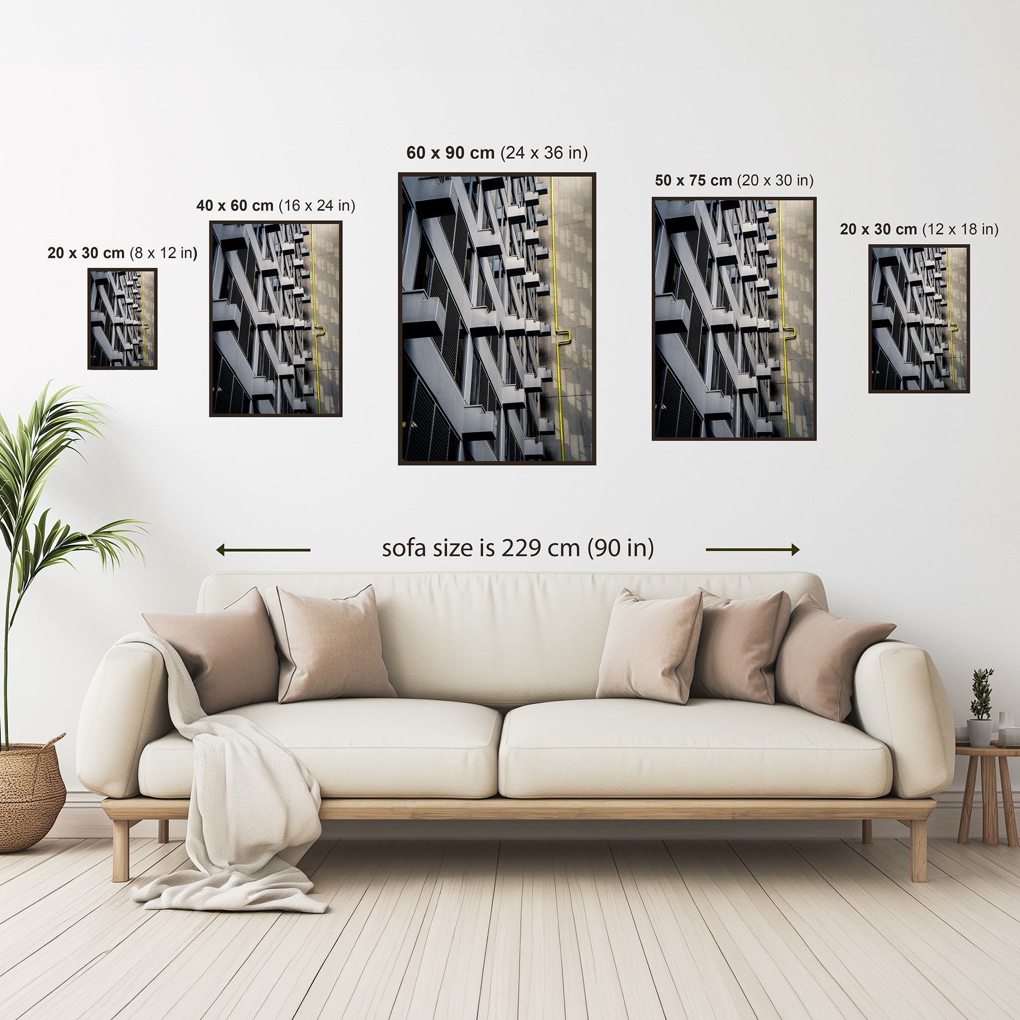 Size guide showing available dimensions for a vertical architectural fine art print displayed above a sofa for scale.