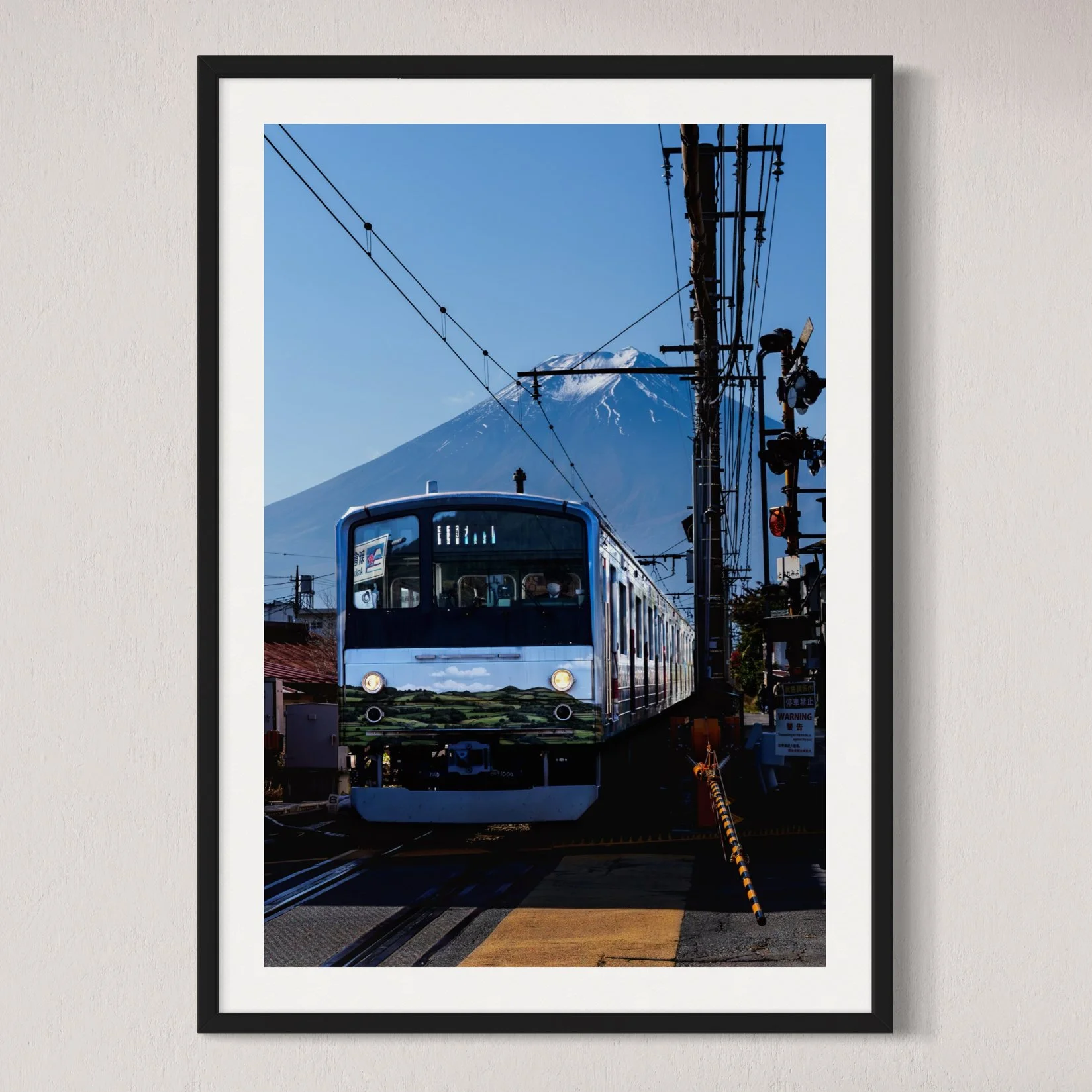 Framed Mount Fuji train photographic print in a black frame