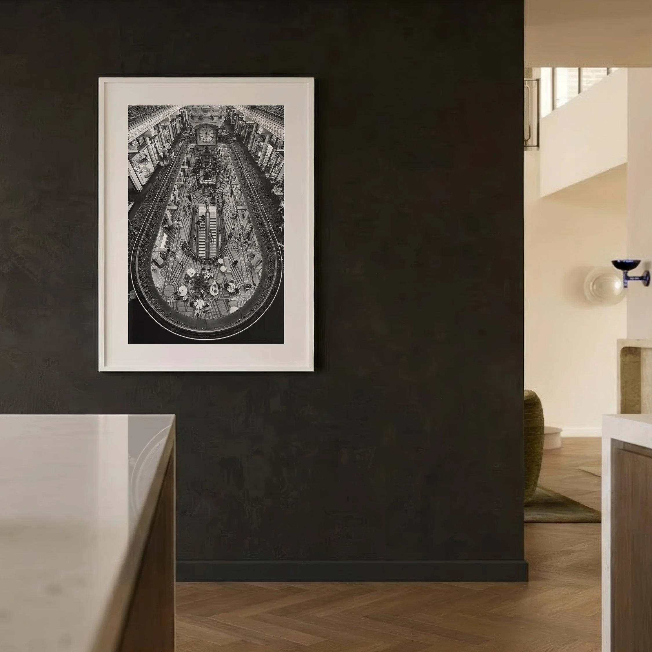 Queen Victoria Building black and white photography print displayed in a white frame against a dark wall in a contemporary interior.