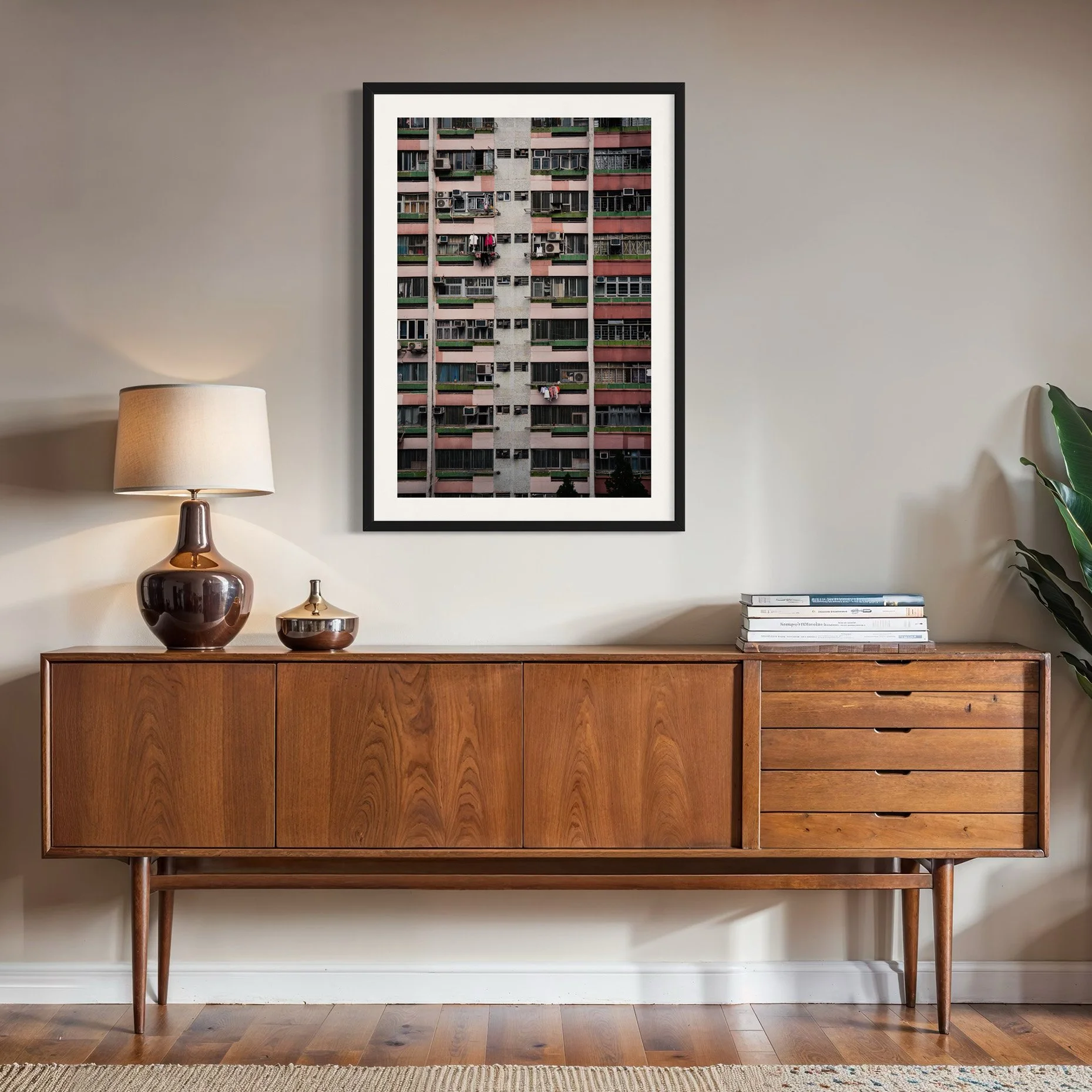 Hong Kong apartment facade photography print displayed above a mid-century wooden sideboard
