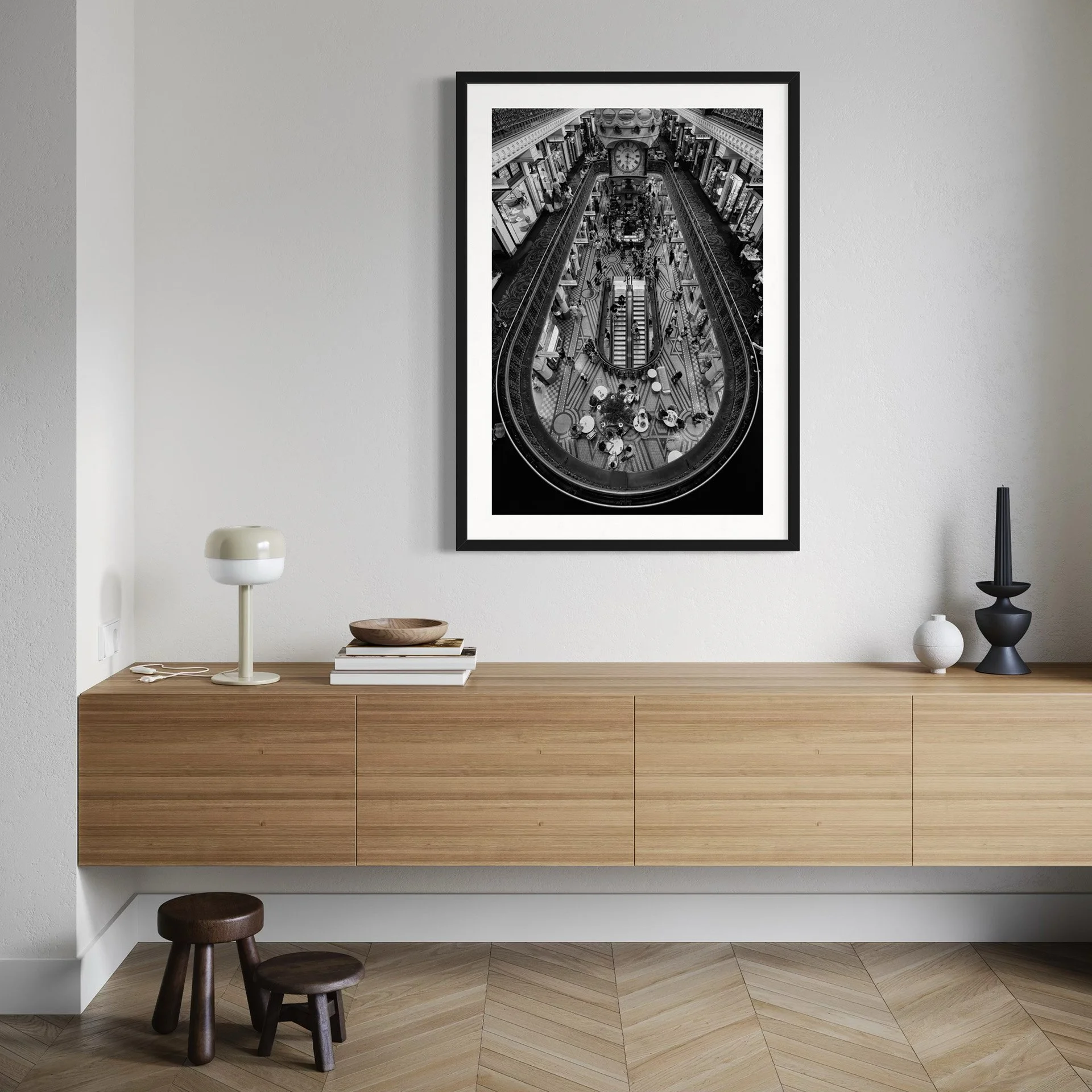 Black and white Sydney architectural photography print displayed above a floating oak sideboard in a minimalist modern interior.