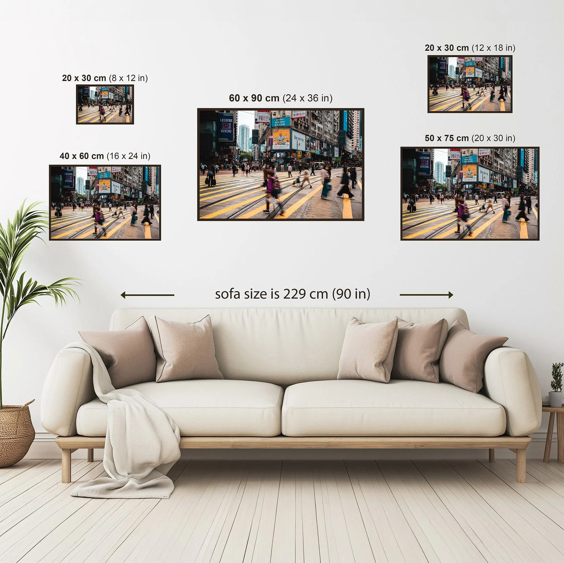 Size guide showing the Hong Kong Crosswalk print displayed above a sofa, comparing all available print sizes from 20 × 30 cm (8 × 12 in) to 60 × 90 cm (24 × 36 in).