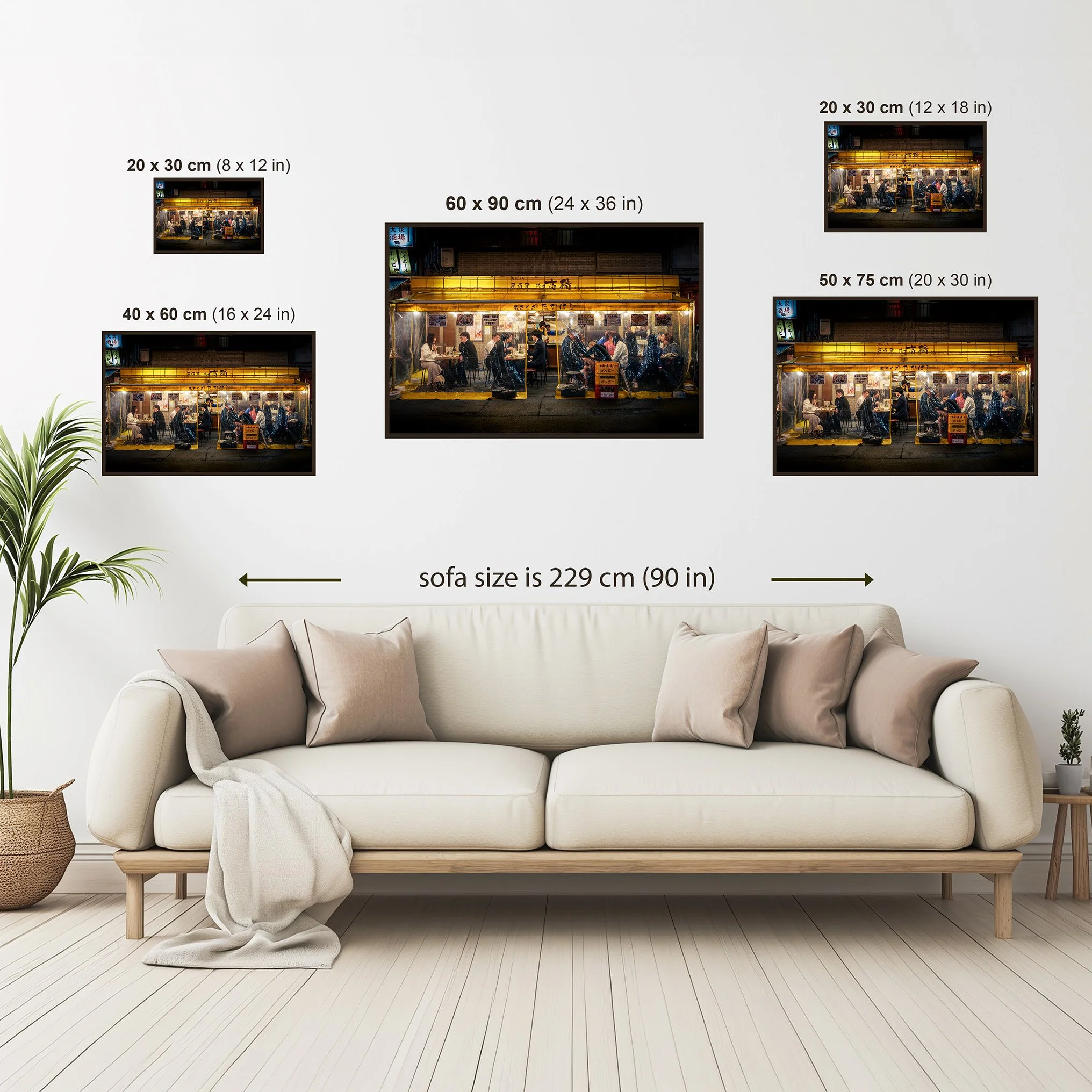 Photography print size guide showing five available wall art sizes from 20 × 30 cm to 60 × 90 cm, illustrated above a sofa for scale.