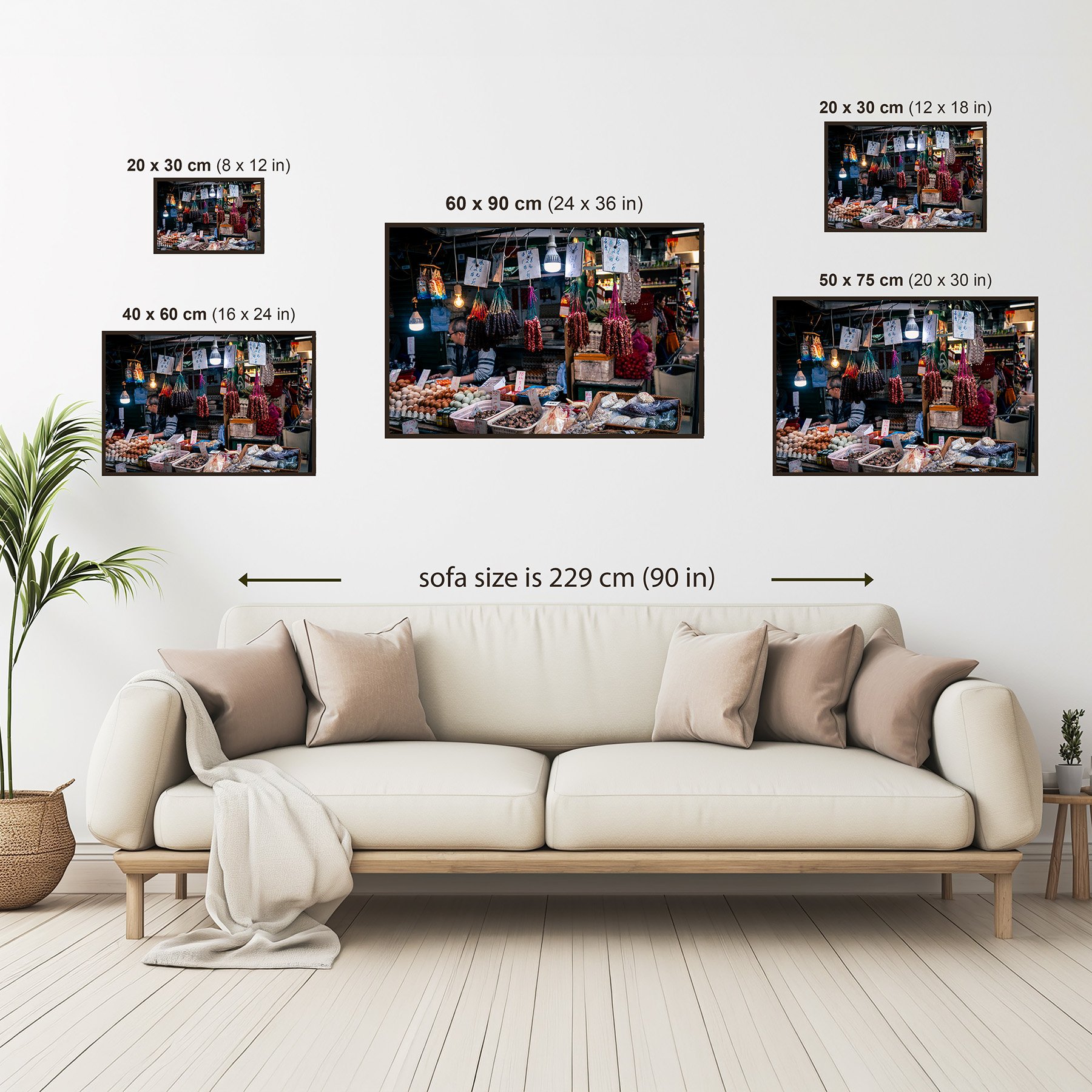 Photography print size guide showing available wall art sizes from 20 × 30 cm to 60 × 90 cm above a sofa for scale.