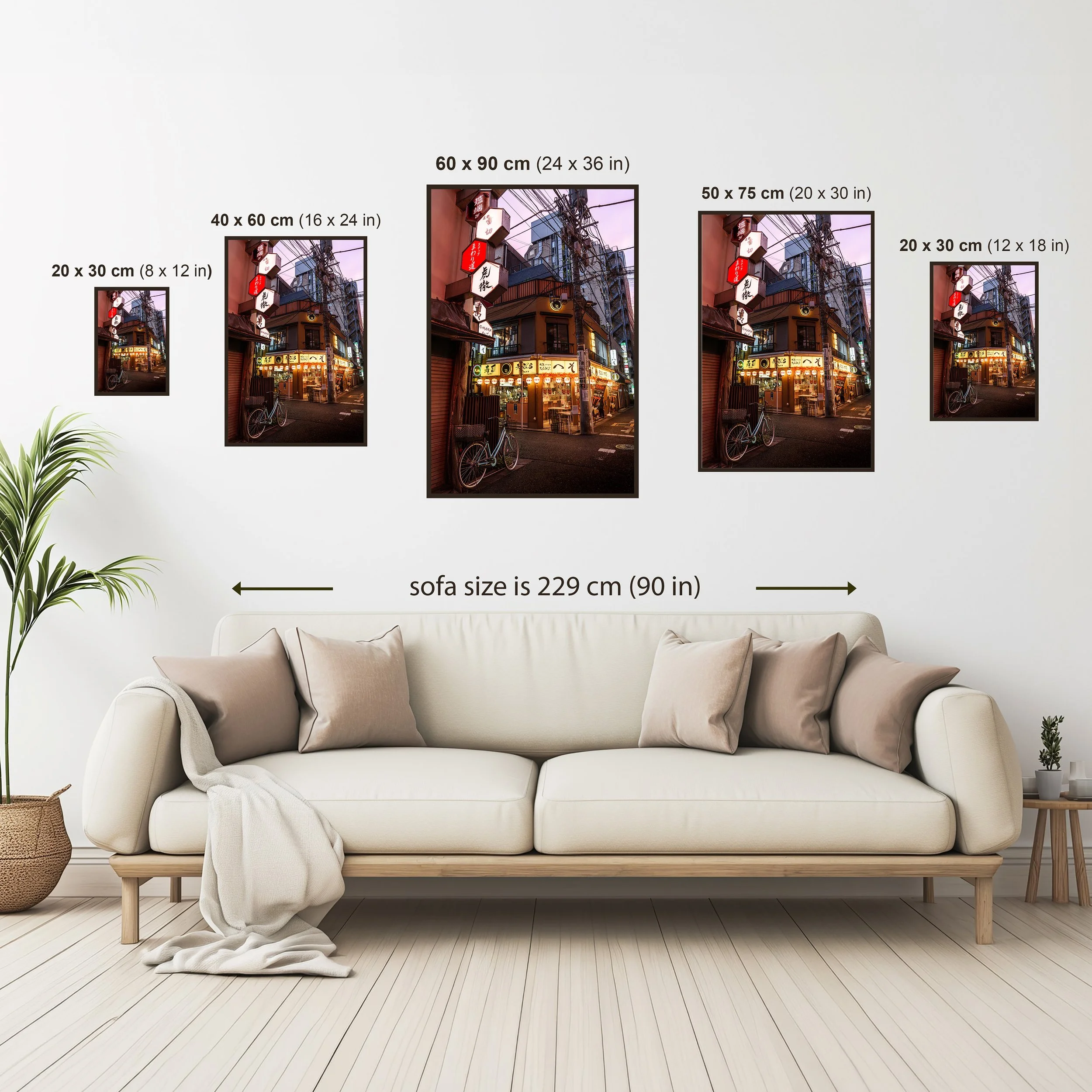 Size comparison guide for portrait format photography prints showing available dimensions above a neutral sofa setting.
