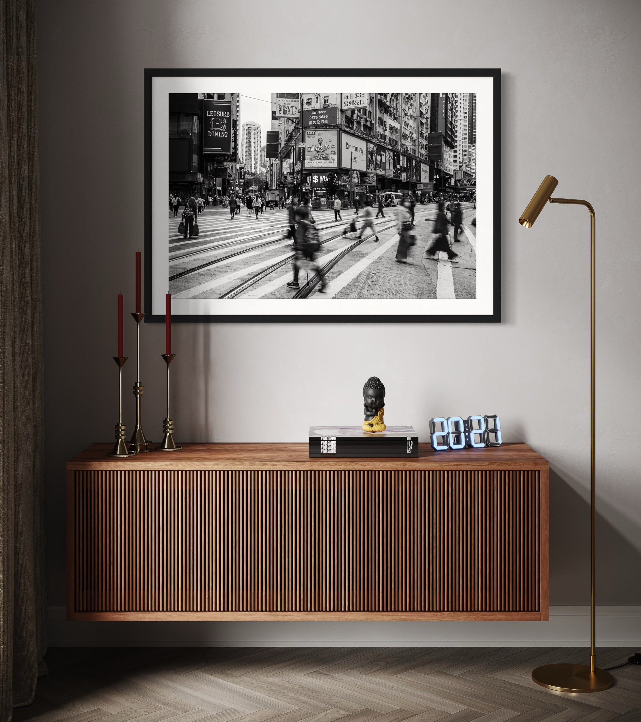 Black framed Hong Kong street photography wall art above a wooden sideboard in a modern interior setting.
