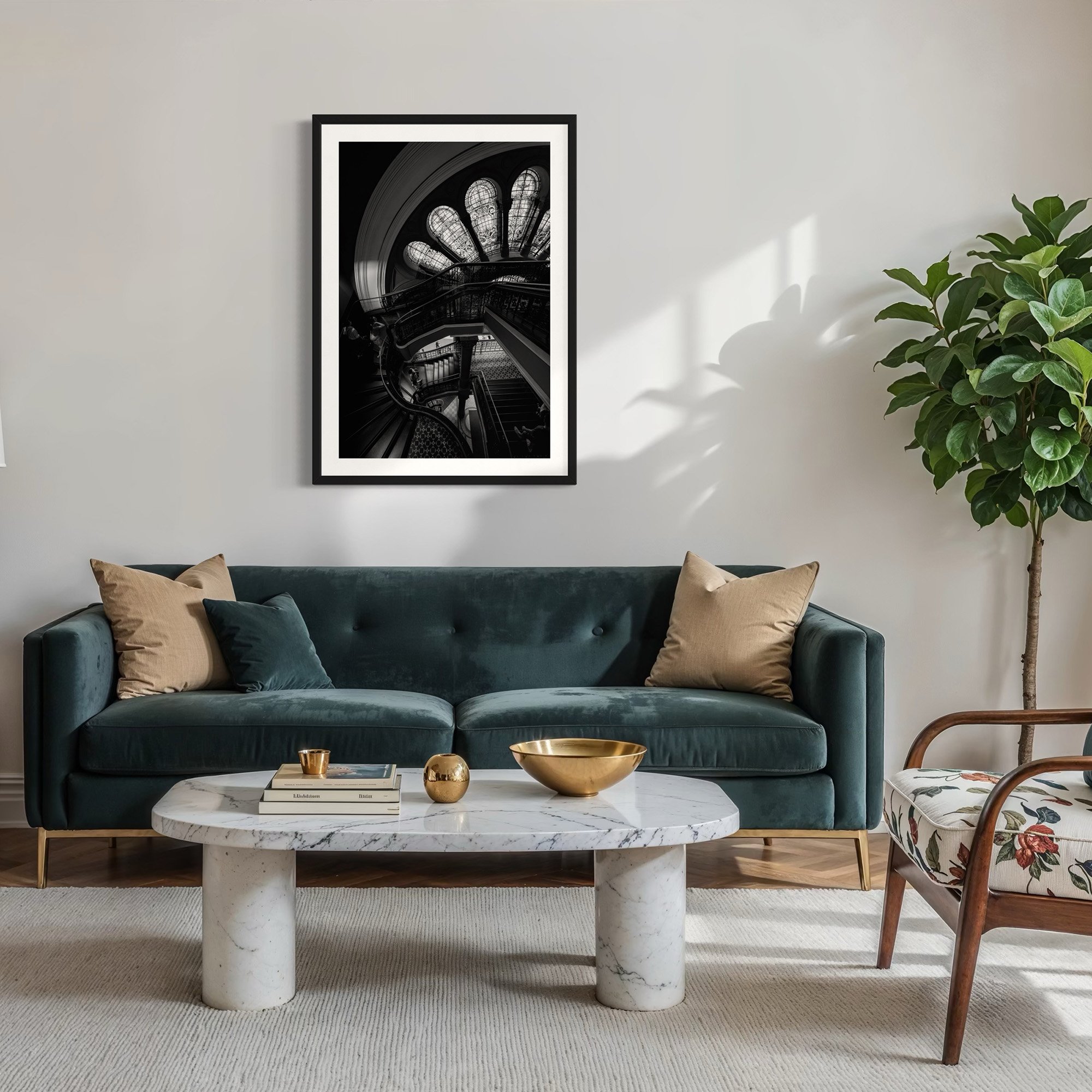 Black and white Queen Victoria Building staircase wall art displayed above a green velvet sofa in a modern living room.