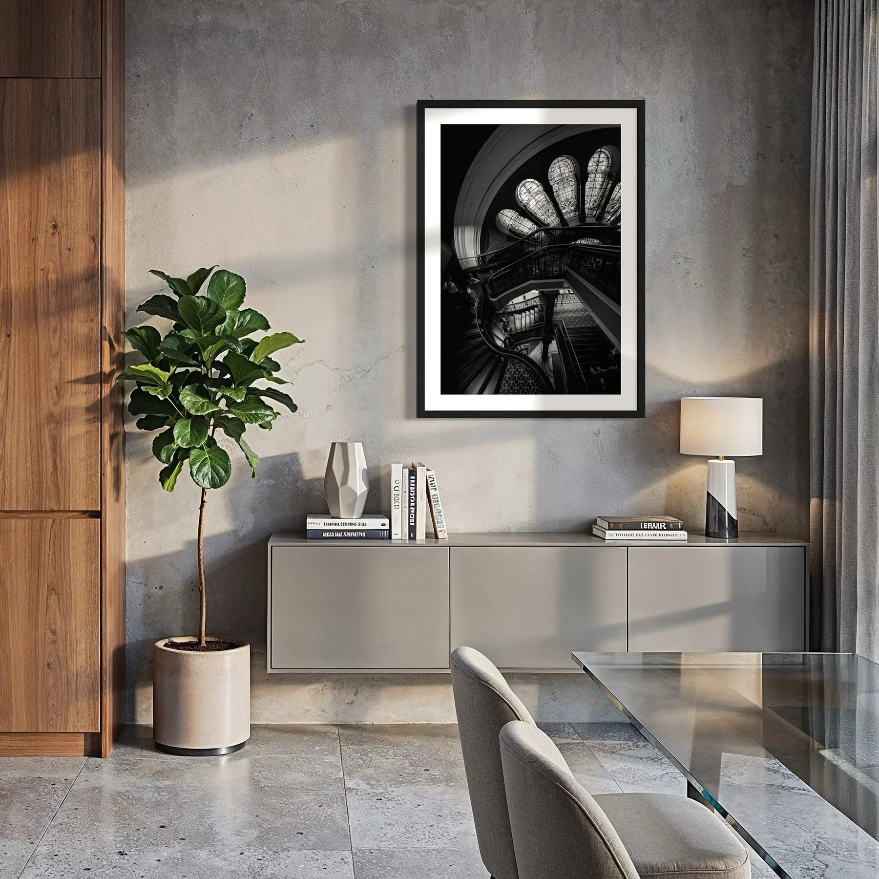 Framed black and white architectural print of the Queen Victoria Building staircase in a contemporary dining room with concrete walls.