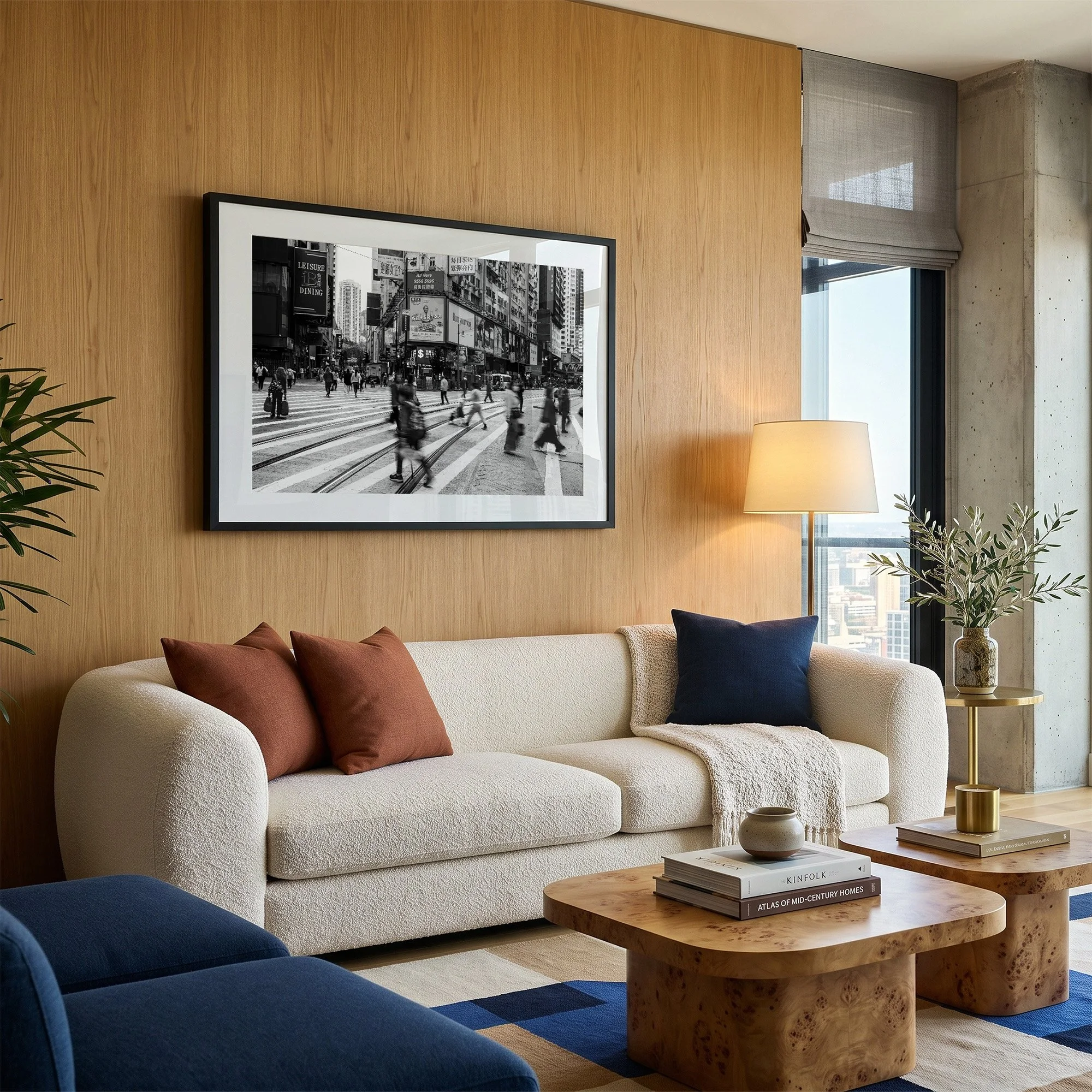Black and white Hong Kong street photography print displayed in a black frame with white mat in a contemporary timber-panelled living room.