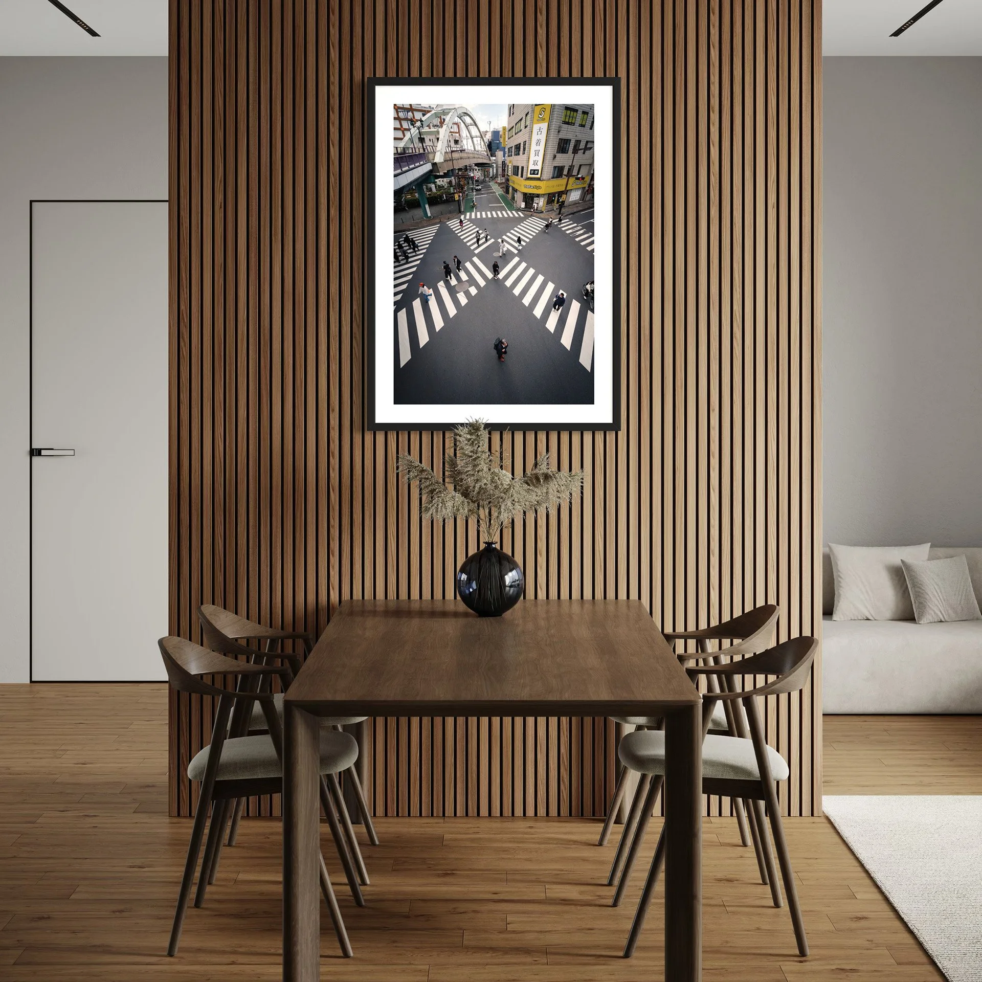 Framed Tokyo street photography print featuring a geometric pedestrian crossing displayed above a timber dining table against a vertical slatted wood feature wall.