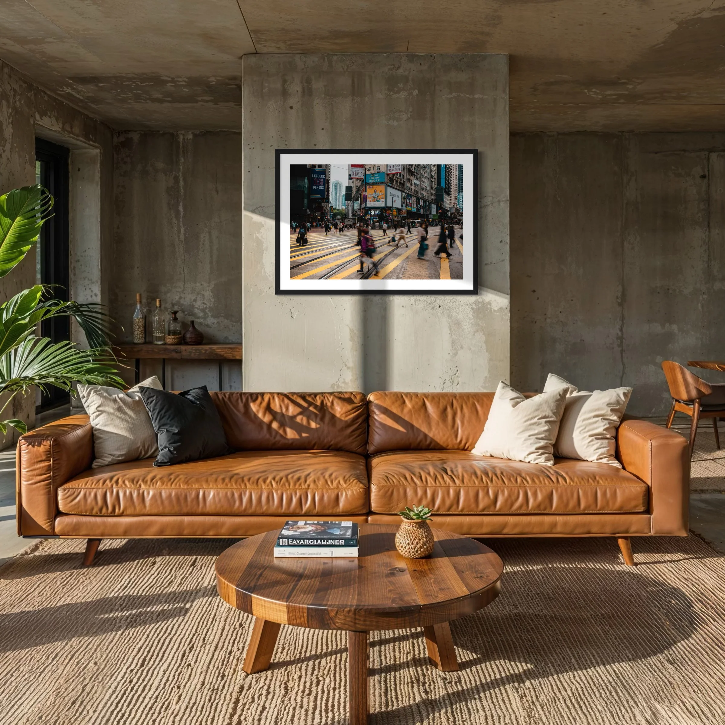 Urban Hong Kong wall art print styled above a brown leather sofa in a warm concrete interior with soft natural light.